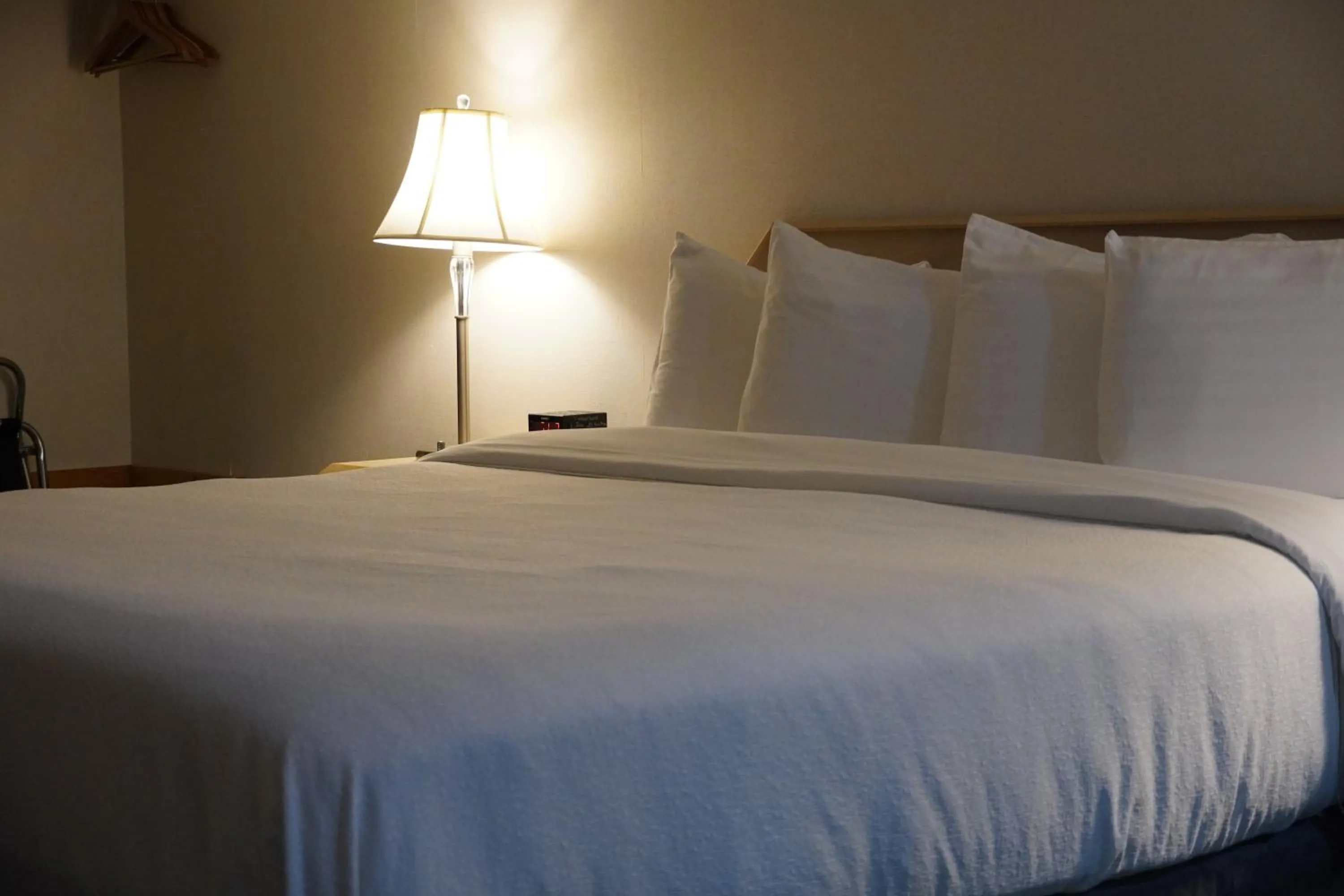 Bed in Timberland Inn & Suites