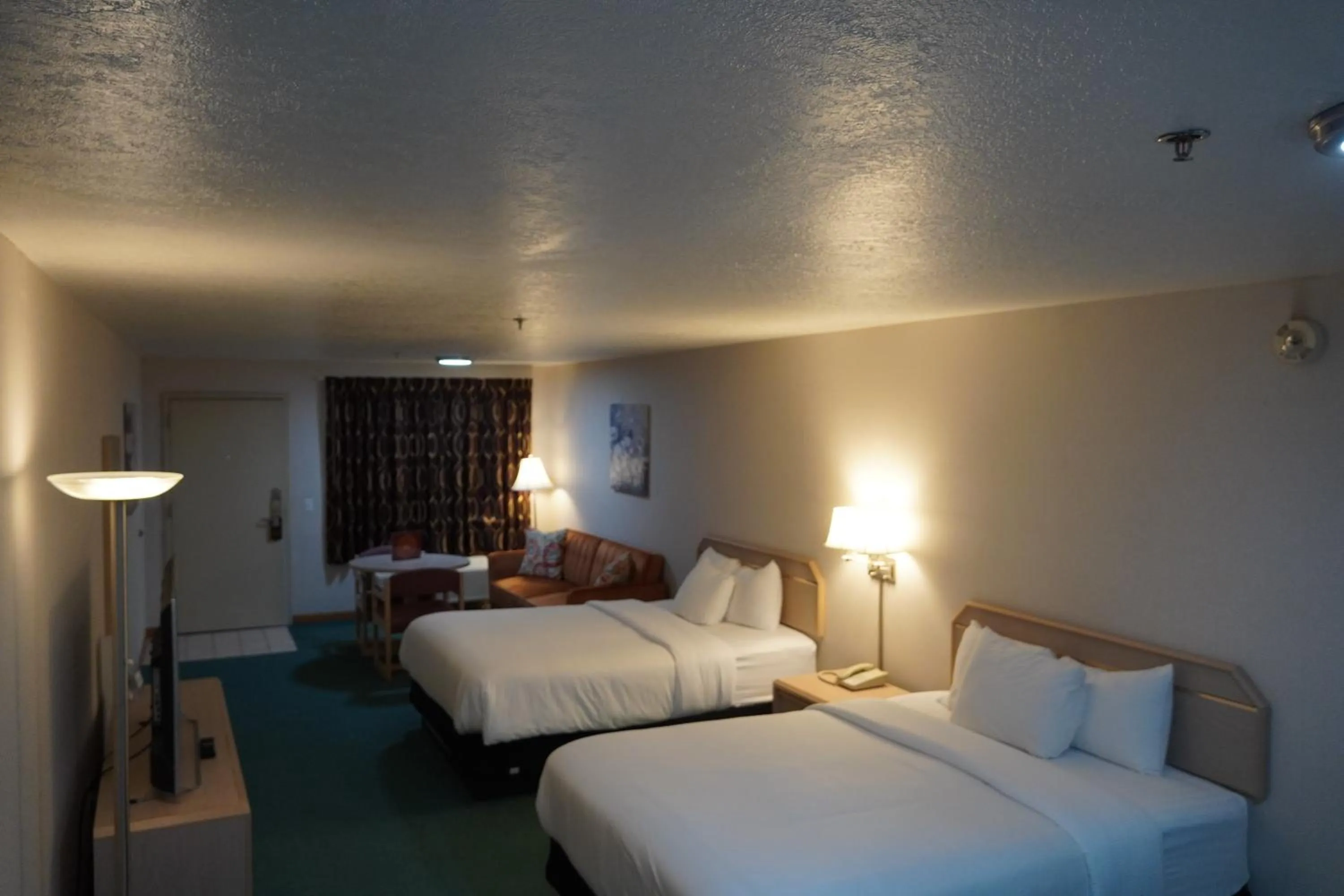 Bed in Timberland Inn & Suites