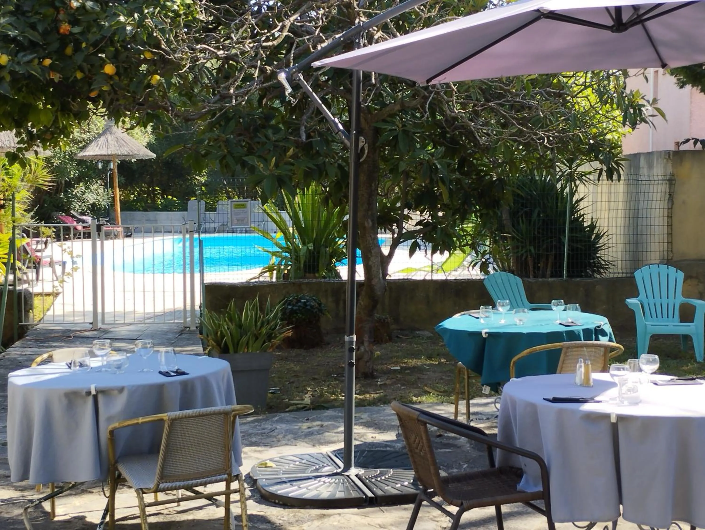 Patio in Logis Hotel Restaurant L'Esquielle