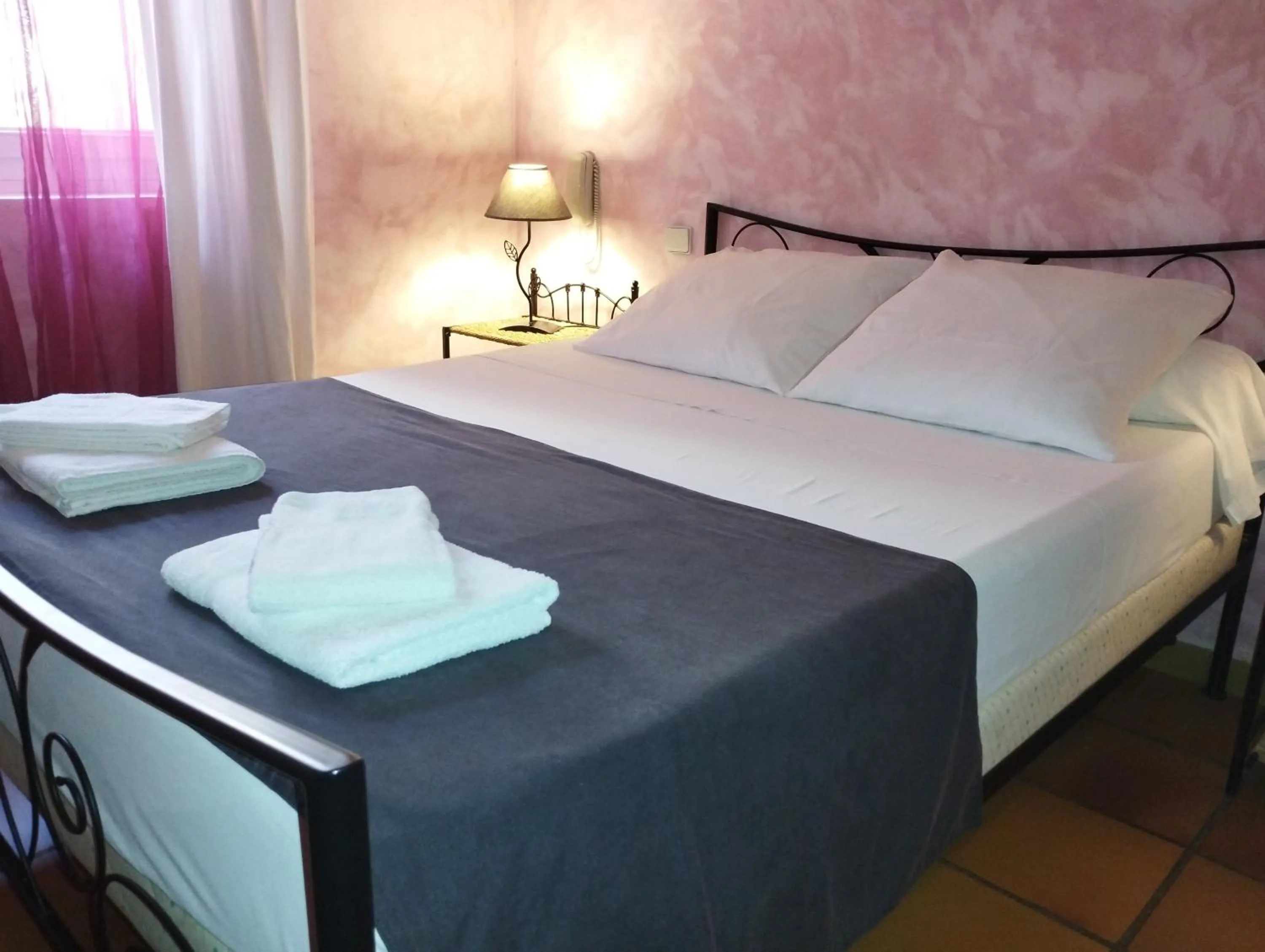 Bed in Logis Hotel Restaurant L'Esquielle