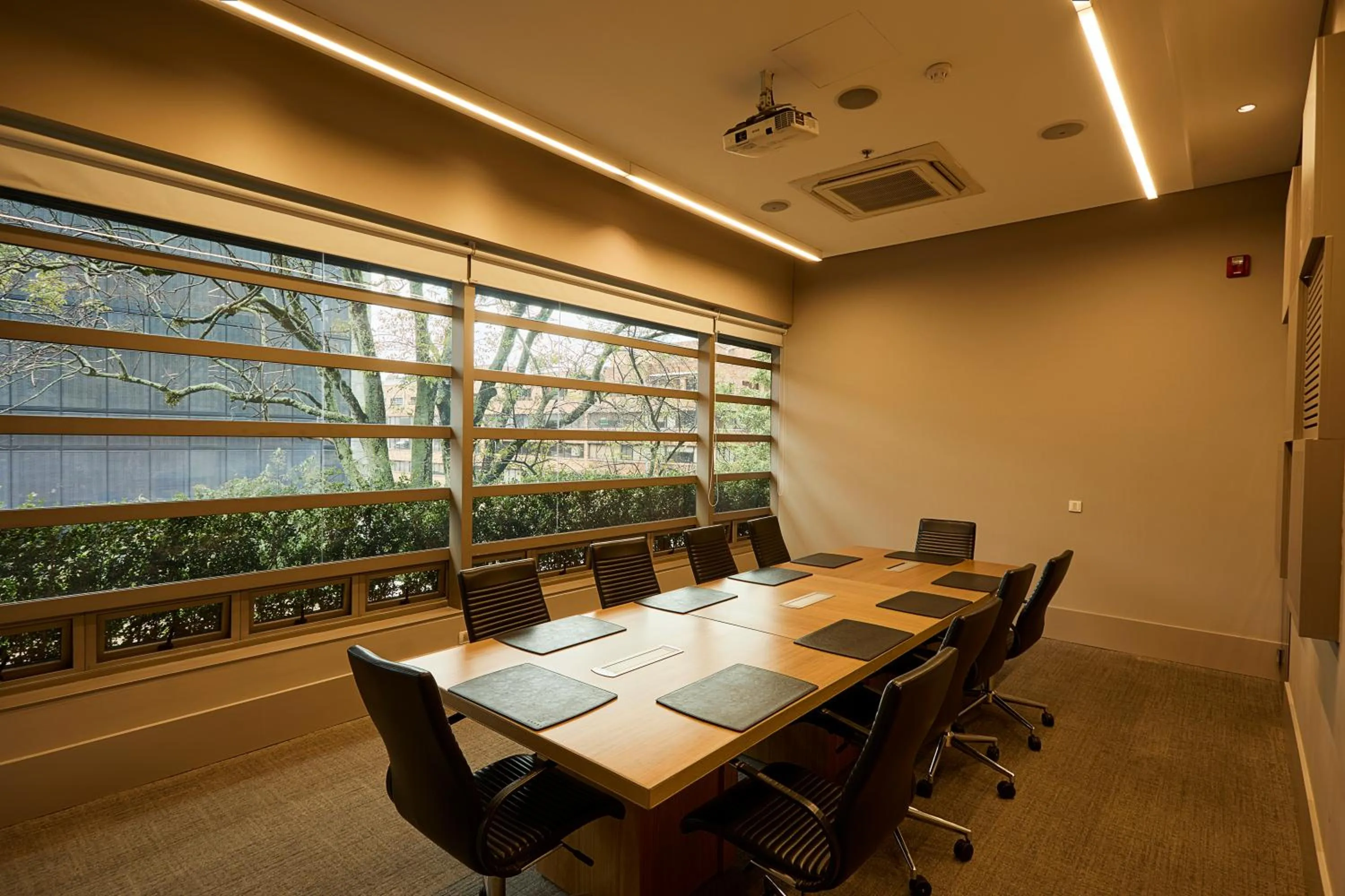 Communal lounge/ TV room in EK Hotel By Preferred Hotels Group