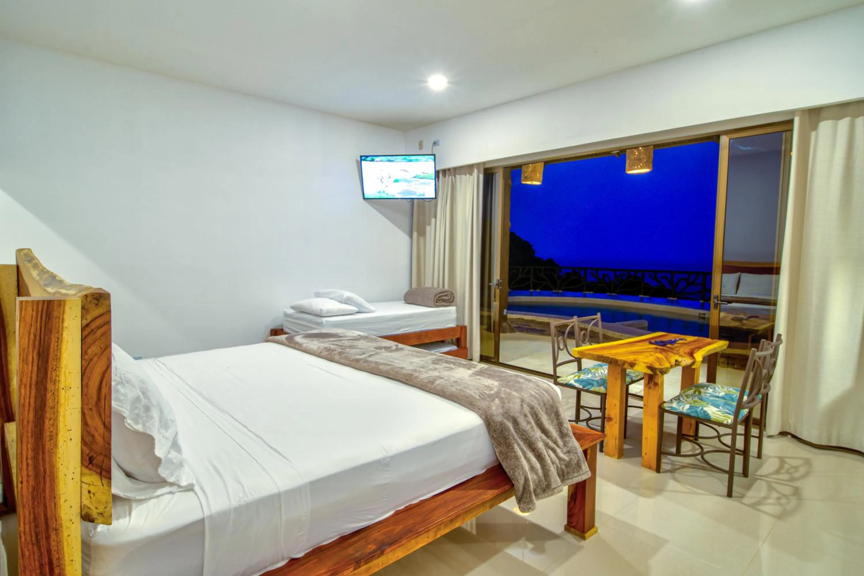 Photo of the whole room, Bed in Akua Suites Ocean View