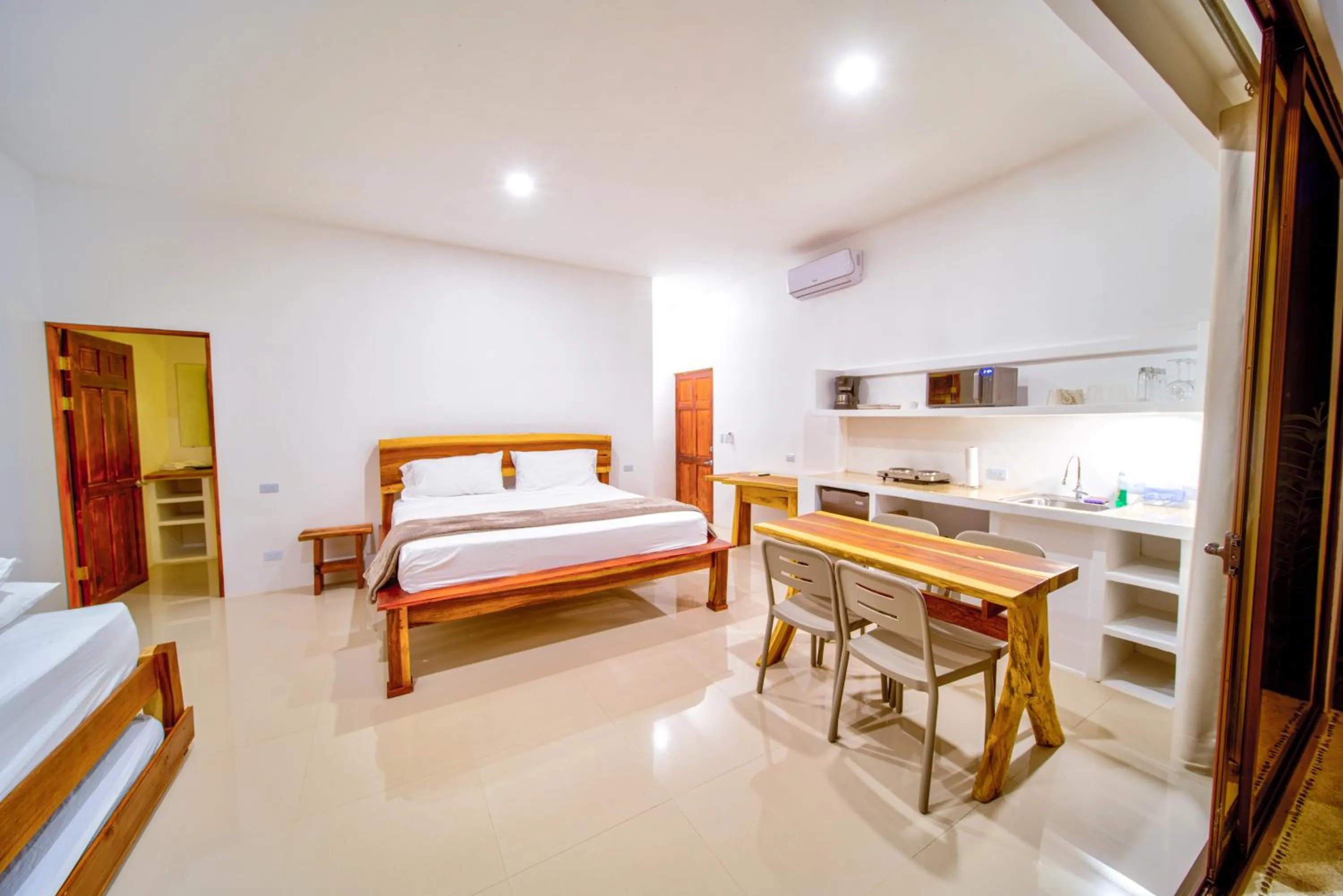 Photo of the whole room, Bed in Akua Suites Ocean View