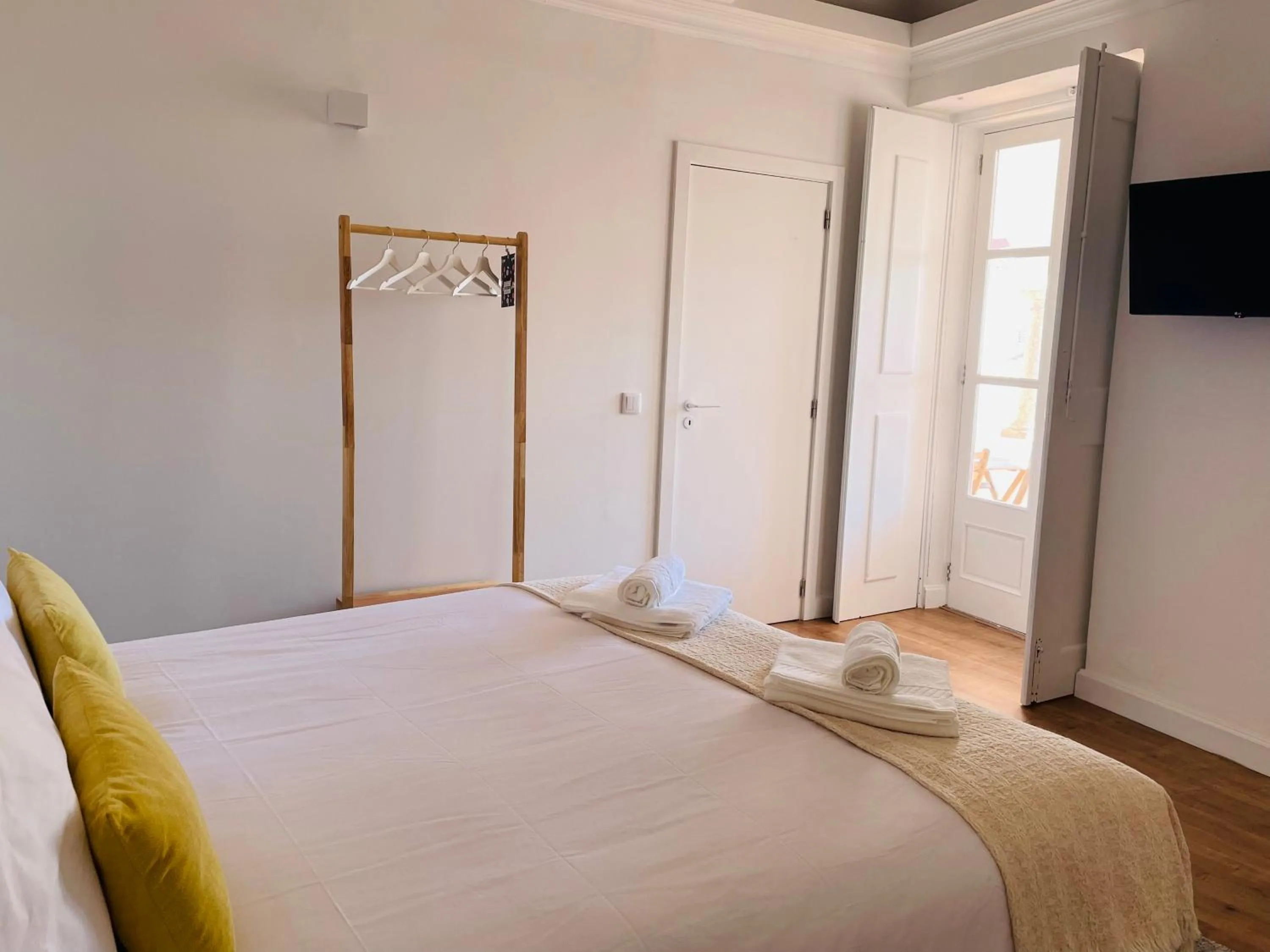 Bed in Casa Soure Suites and Apartments