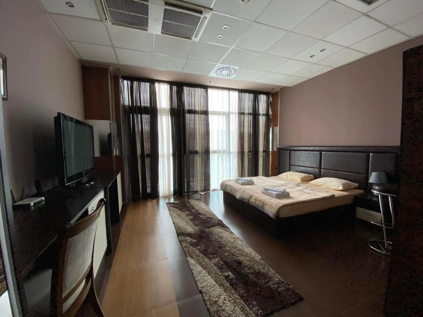 Communal lounge/ TV room, Bed in Hotel Fortuna