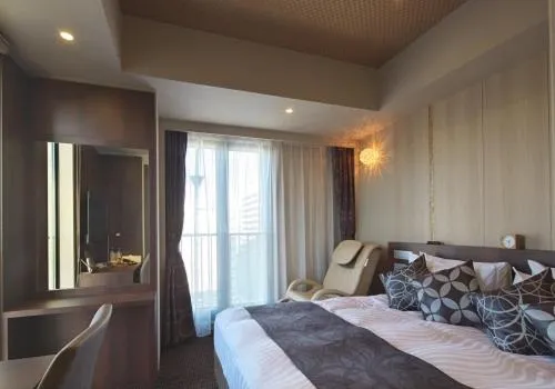 Bed in Hotel Coco Grand