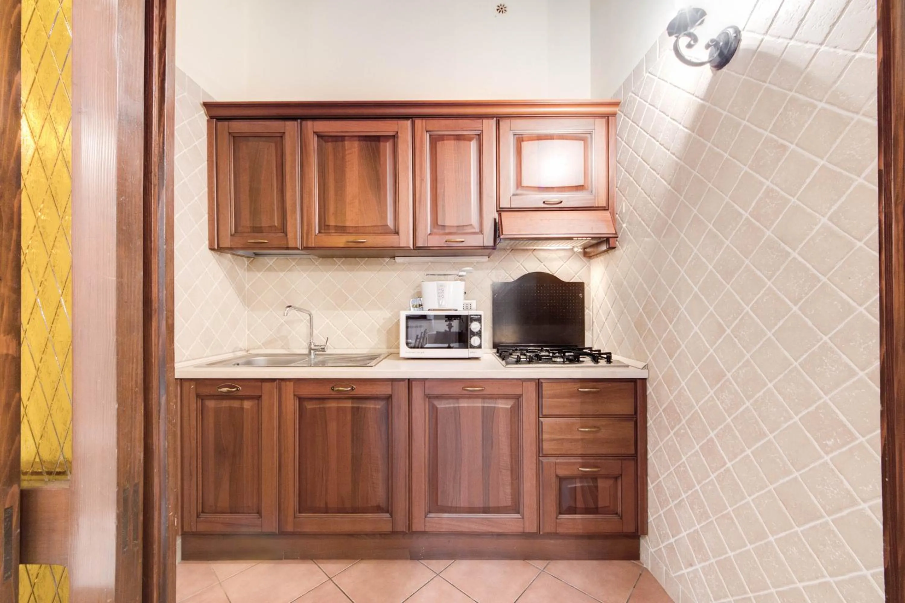 Kitchen or kitchenette in Elegant Apartment Behind the Colosseum