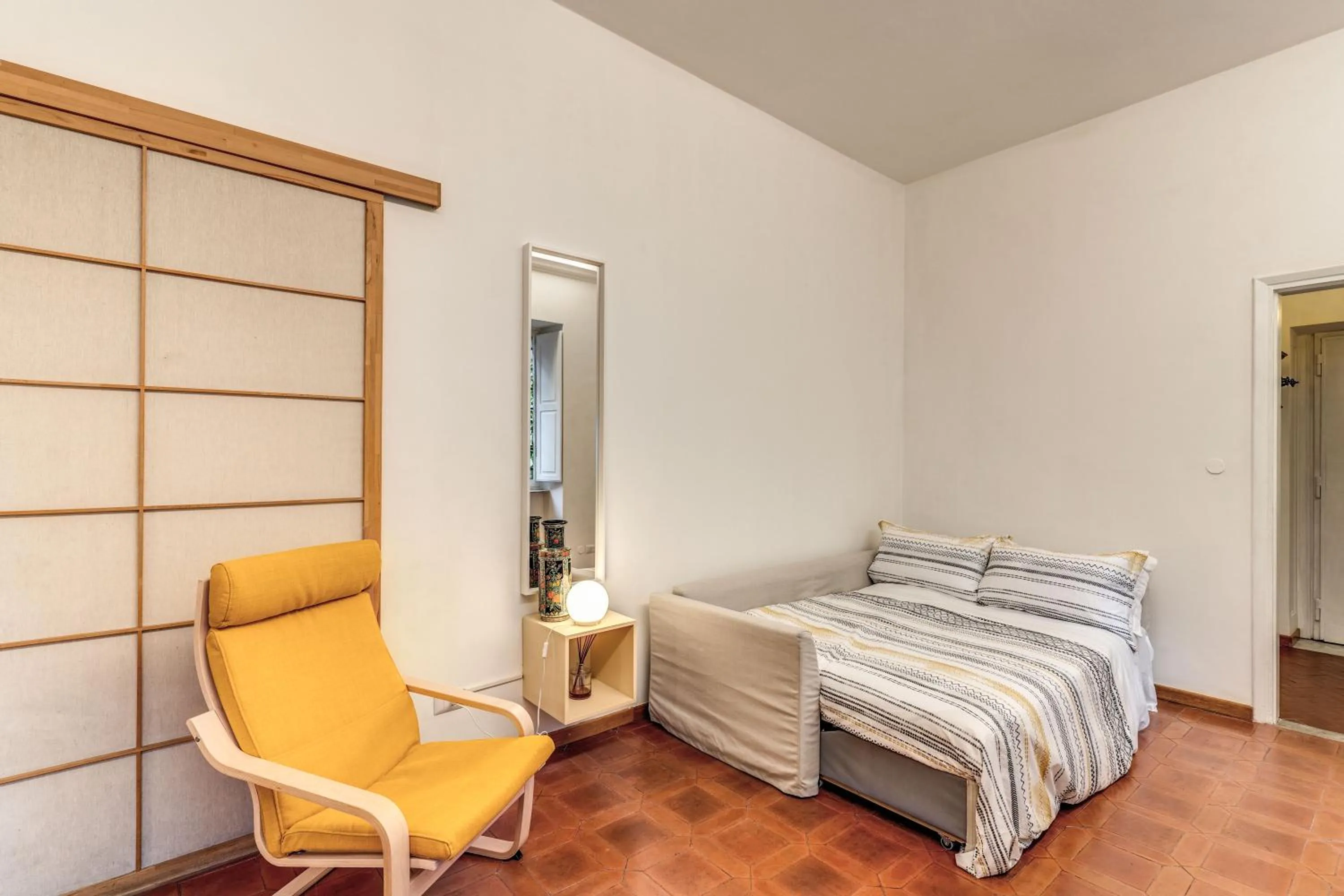 Living room, Bed in Elegant Apartment Behind the Colosseum