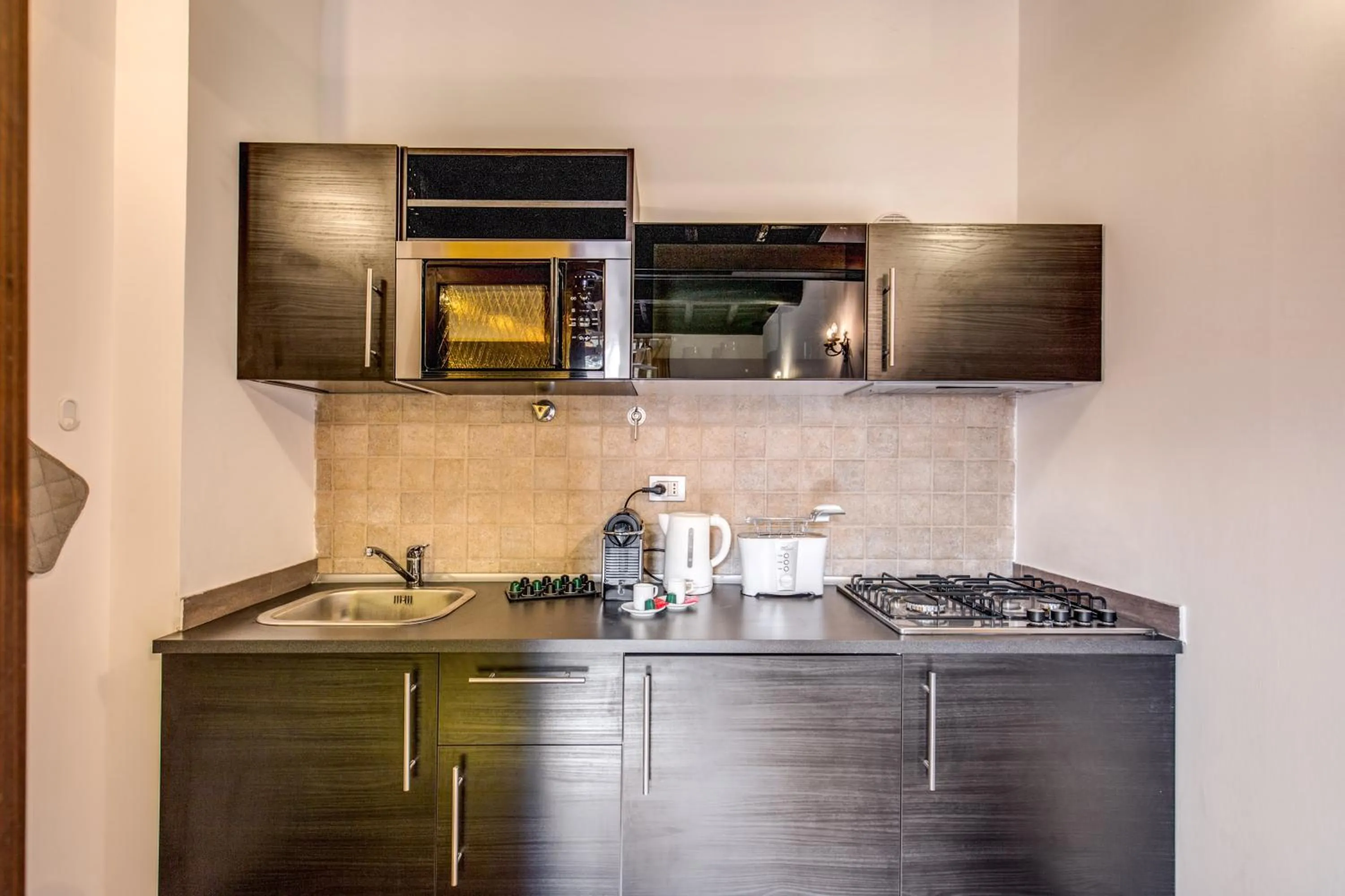 stove in Elegant Apartment Behind the Colosseum