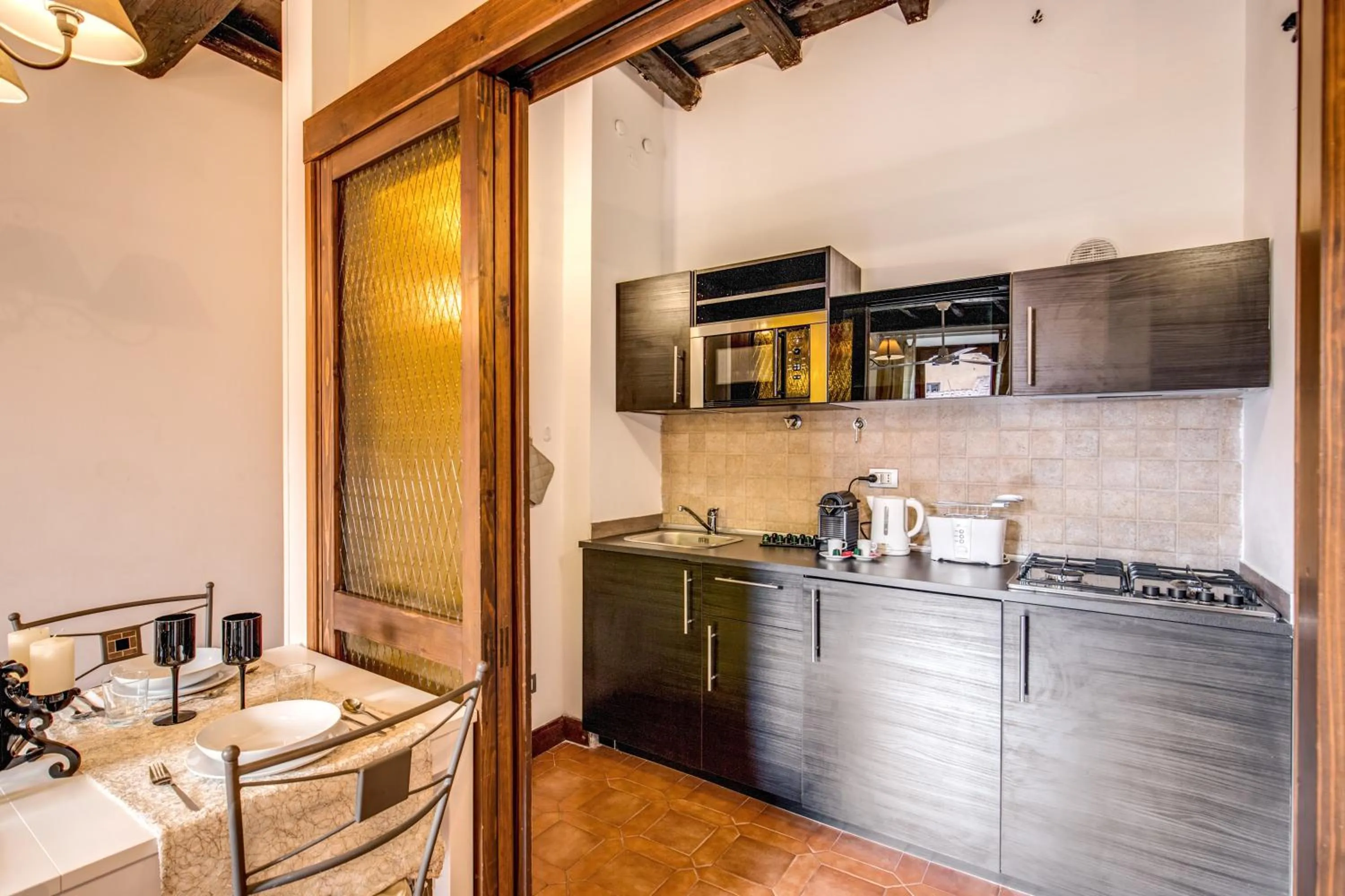 stove in Elegant Apartment Behind the Colosseum
