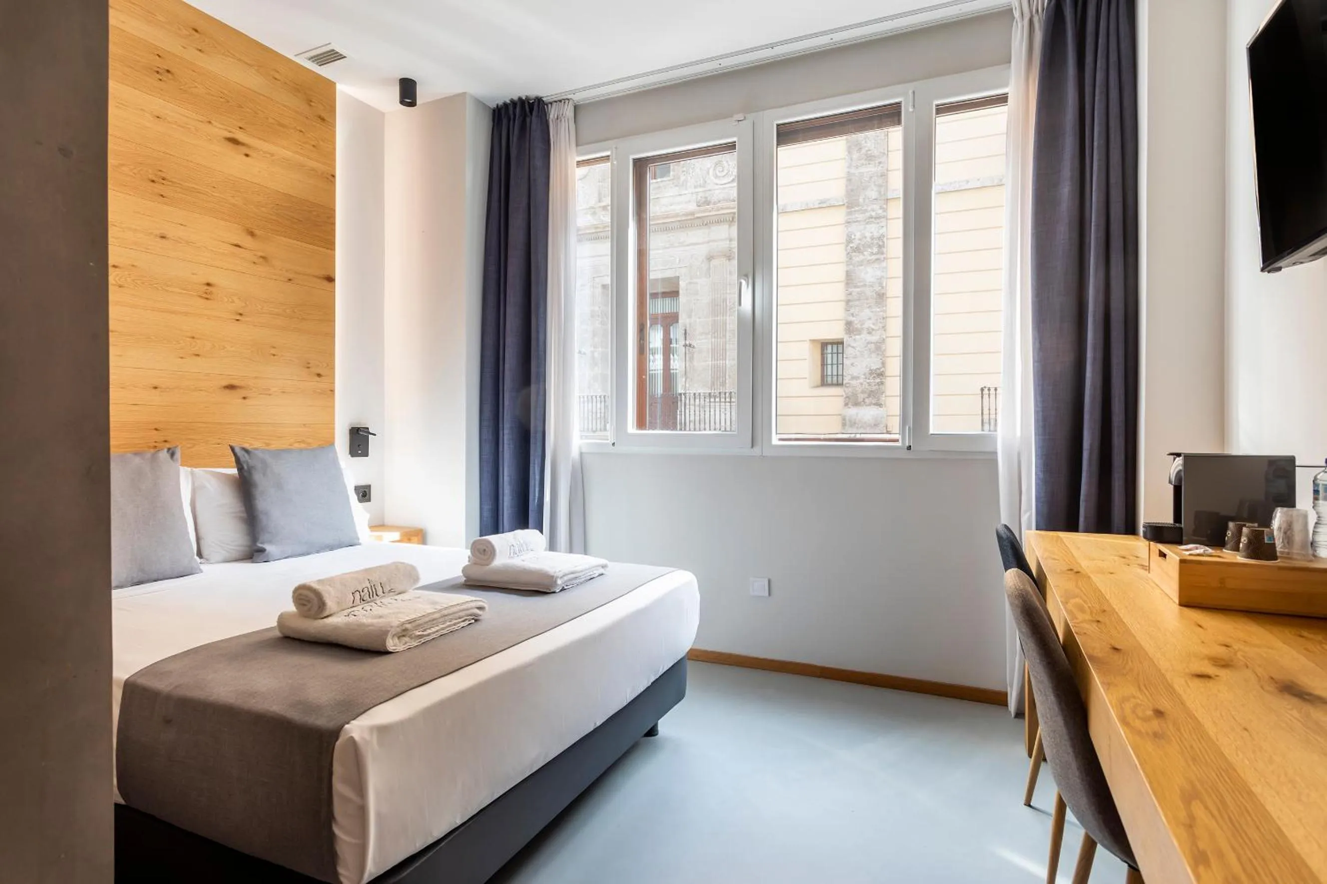 Bed in NALU Valencia Boutique Rooms