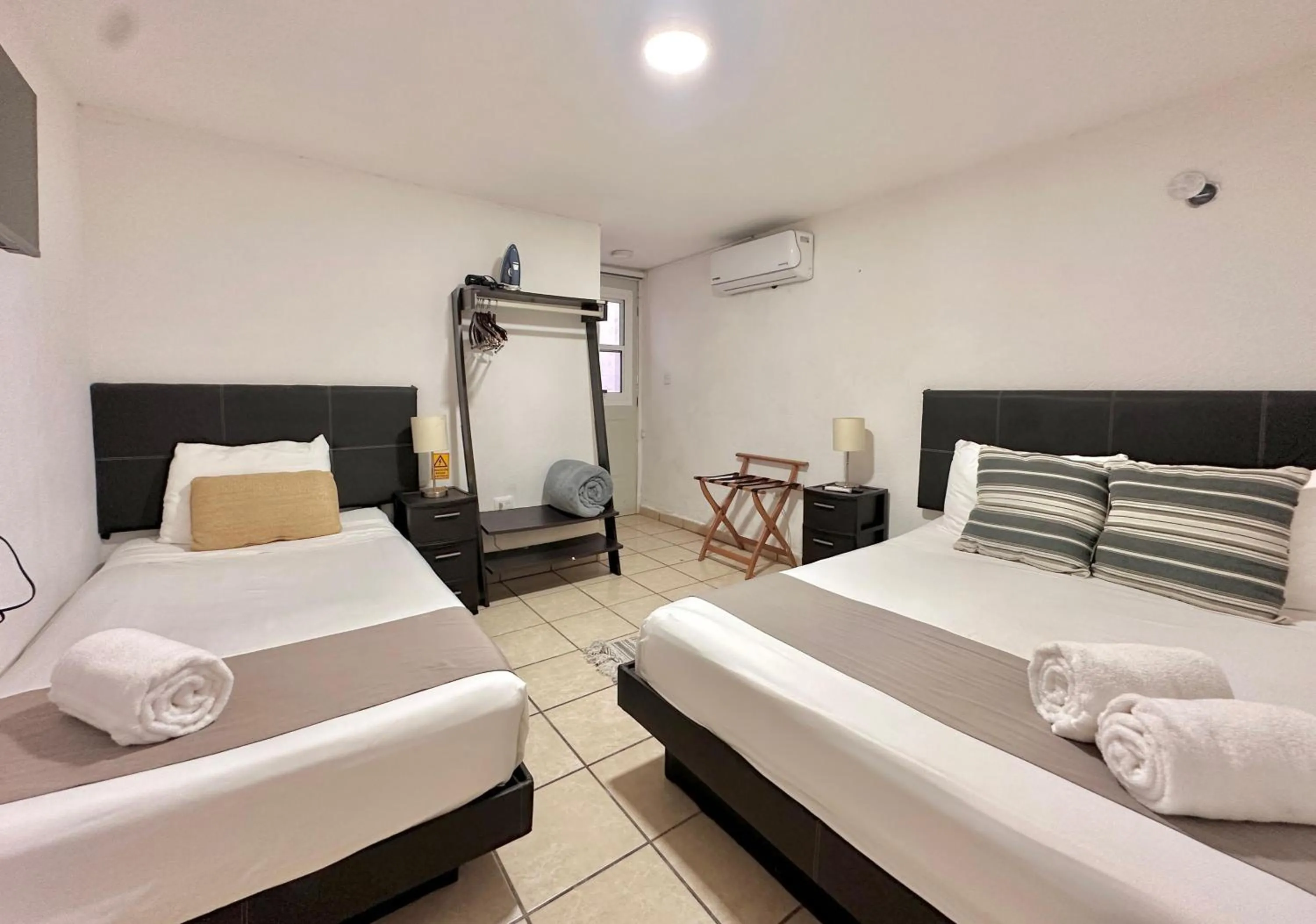 Photo of the whole room, Bed in Coco Suites by Andiani Travel