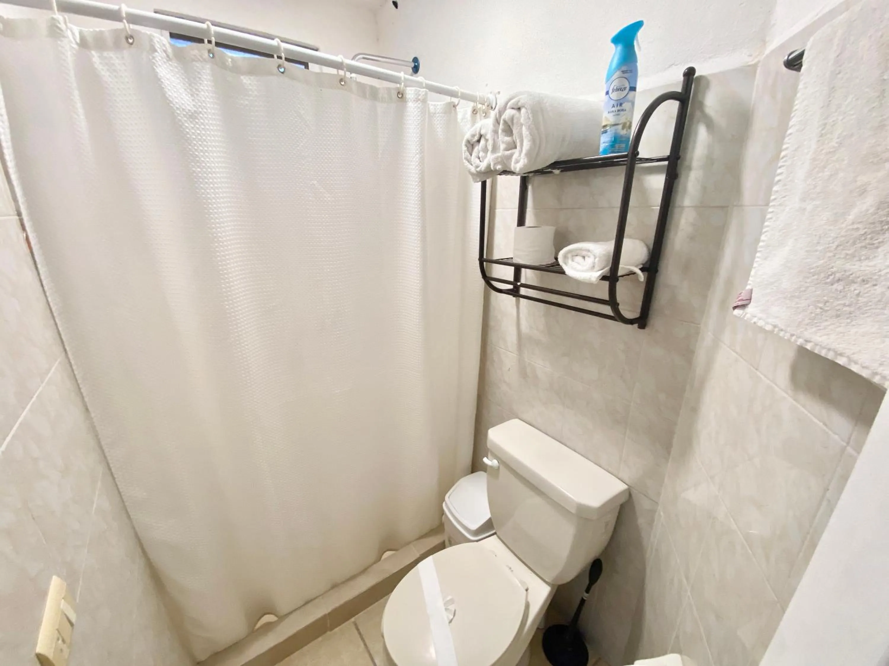 Bathroom in Coco Suites by Andiani Travel