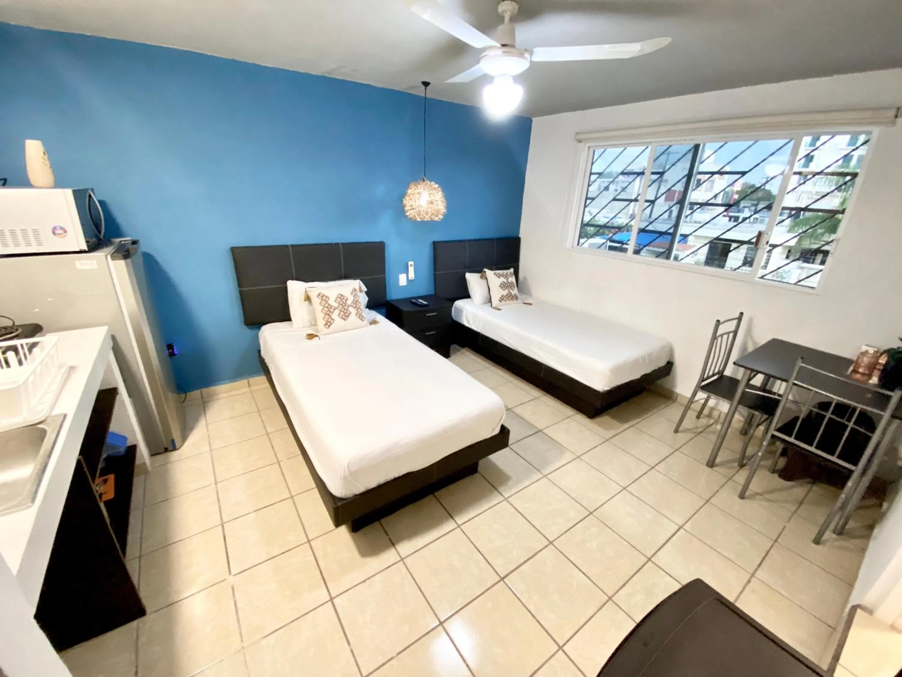 Kitchen or kitchenette, Bed in Coco Suites by Andiani Travel