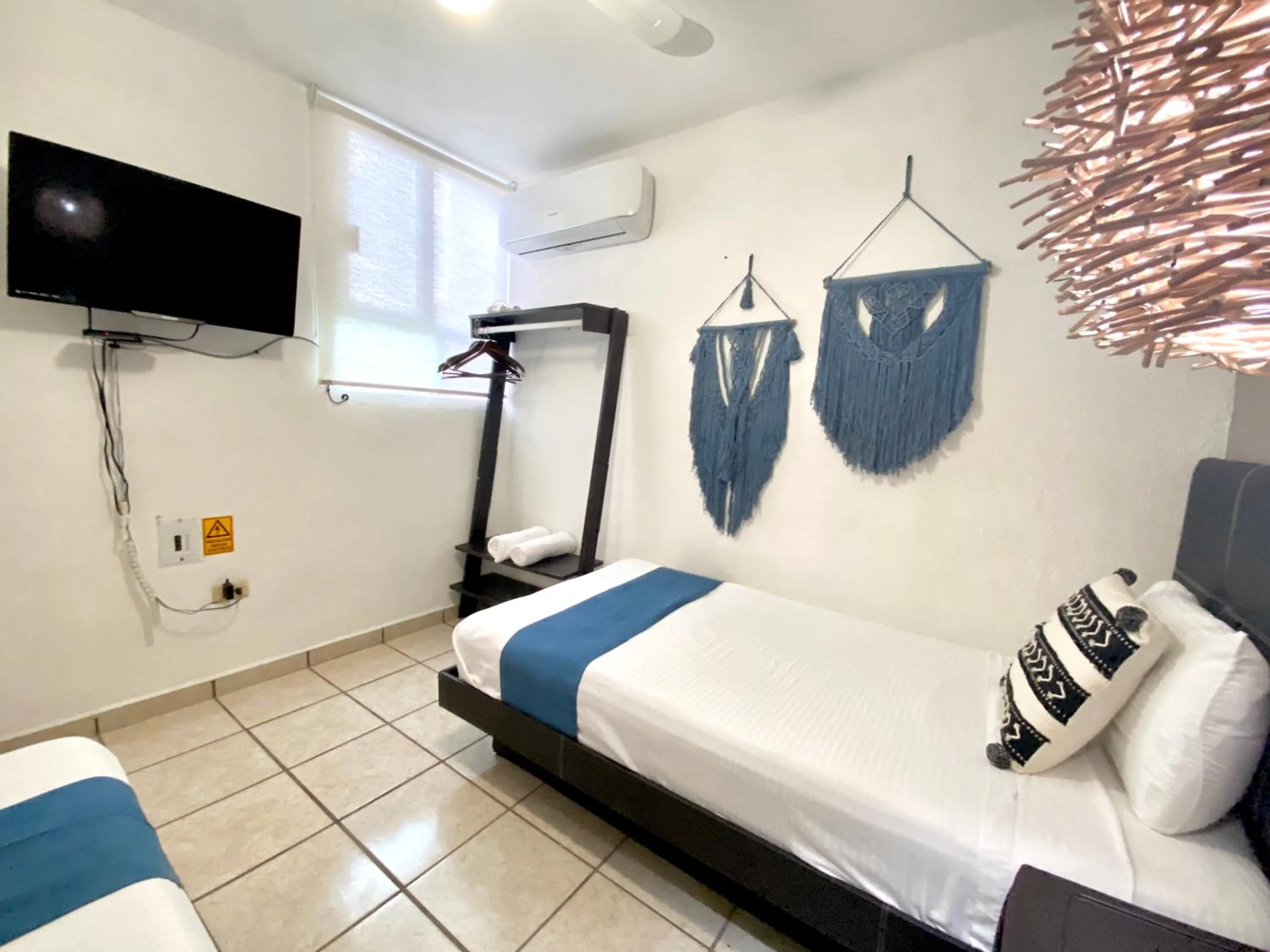 TV and multimedia, Bed in Coco Suites by Andiani Travel