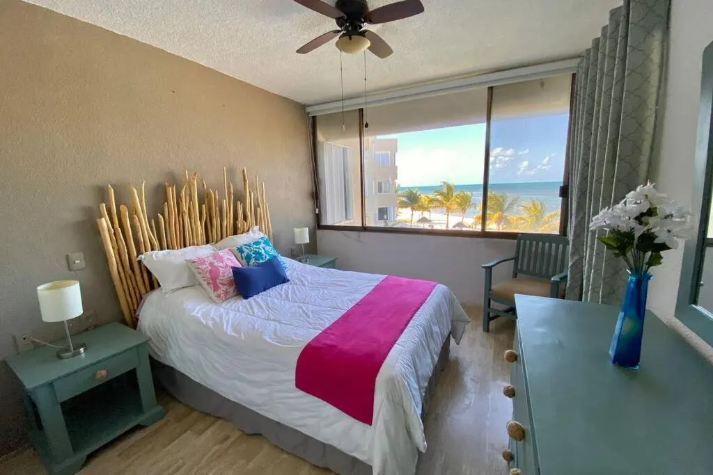 Bed in Oceanfront Condo BM By Andiani