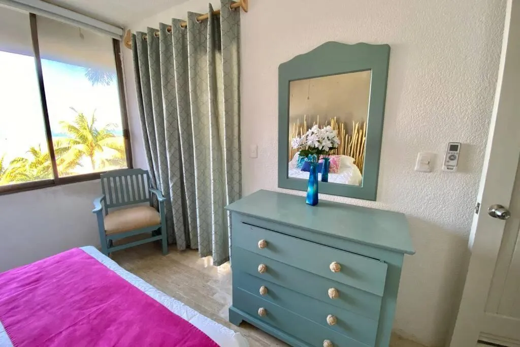 Bed in Oceanfront Condo BM By Andiani