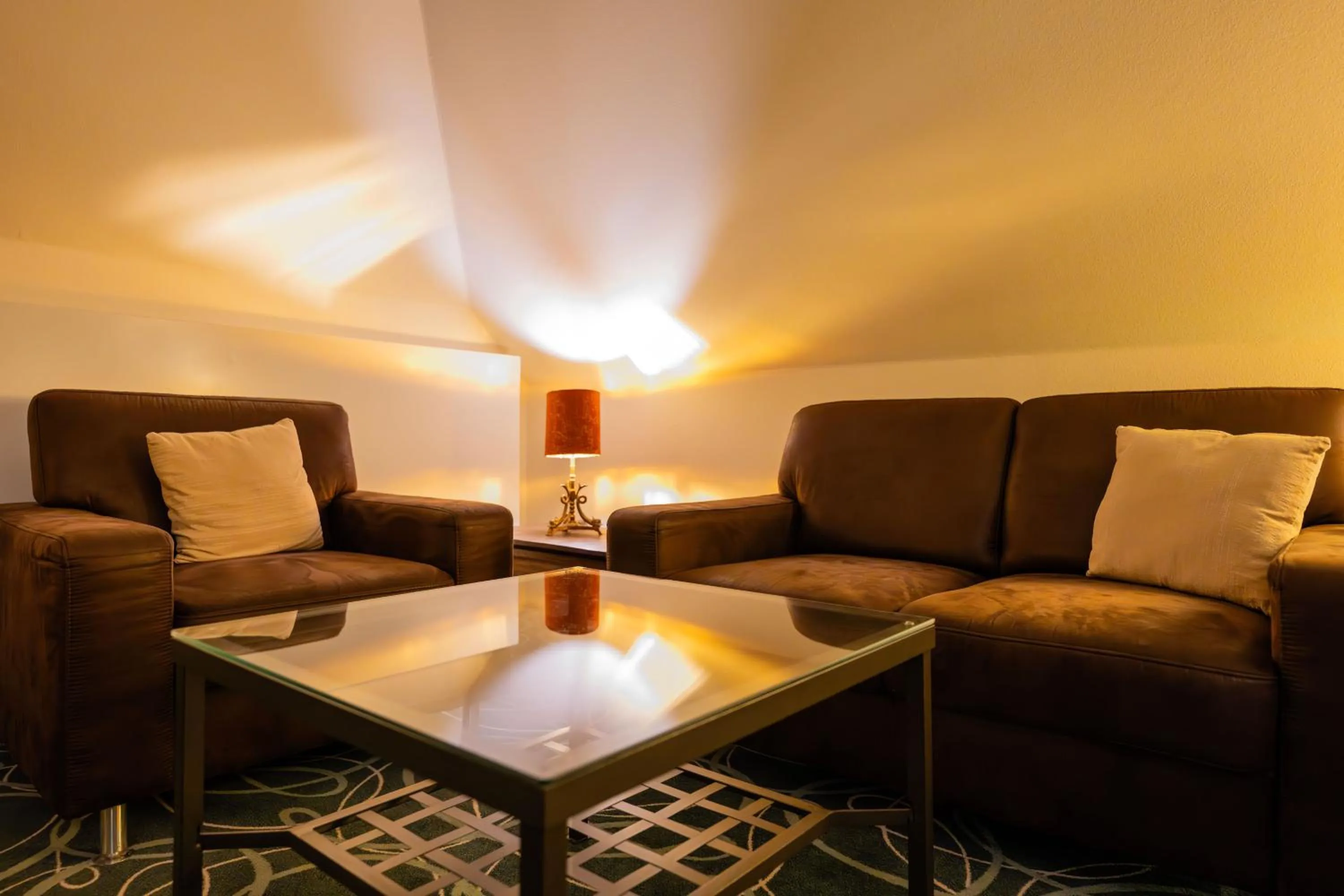 Seating area in Zeitgeist Rathen by STEIGER Hotels