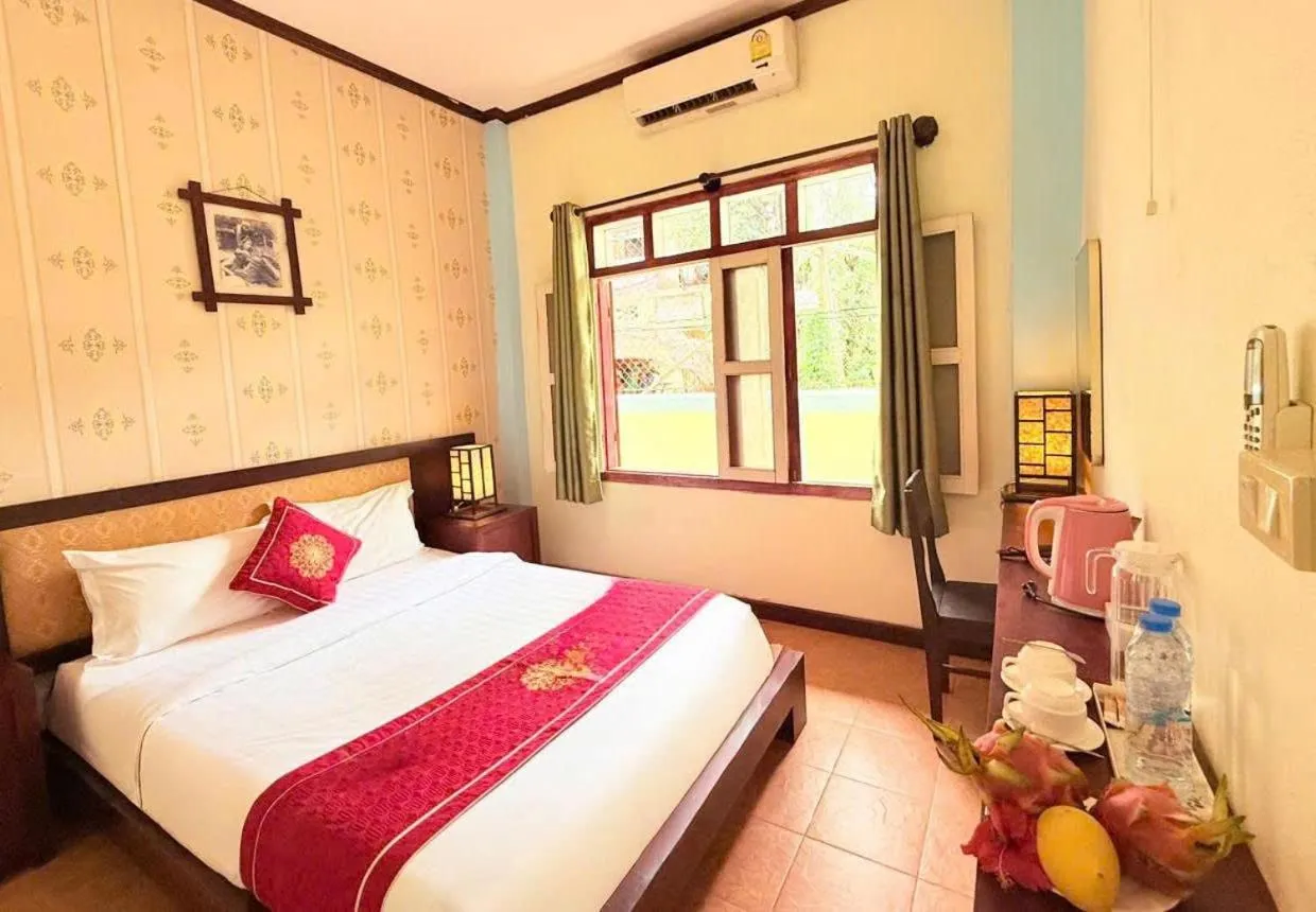 Photo of the whole room, Bed in Luang Prabang Manichan Villa