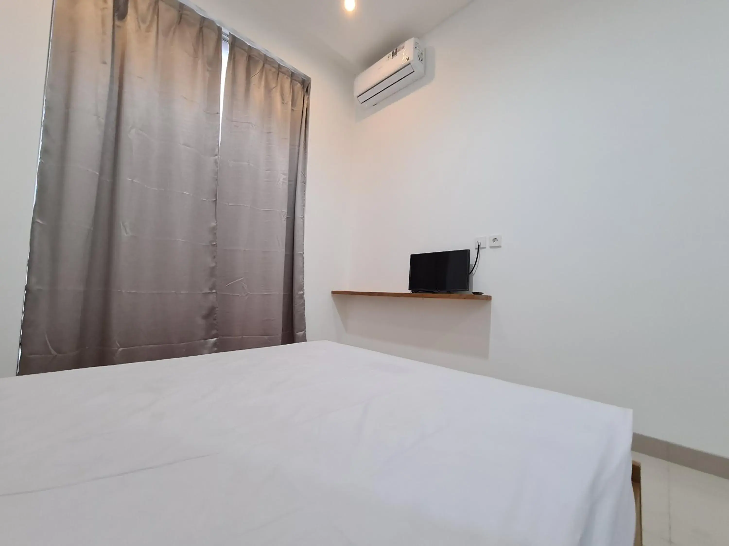 Bed in Graha Martadinata Syariah Mitra RedDoorz Bed in Graha Martadinata Syariah Mitra RedDoorz