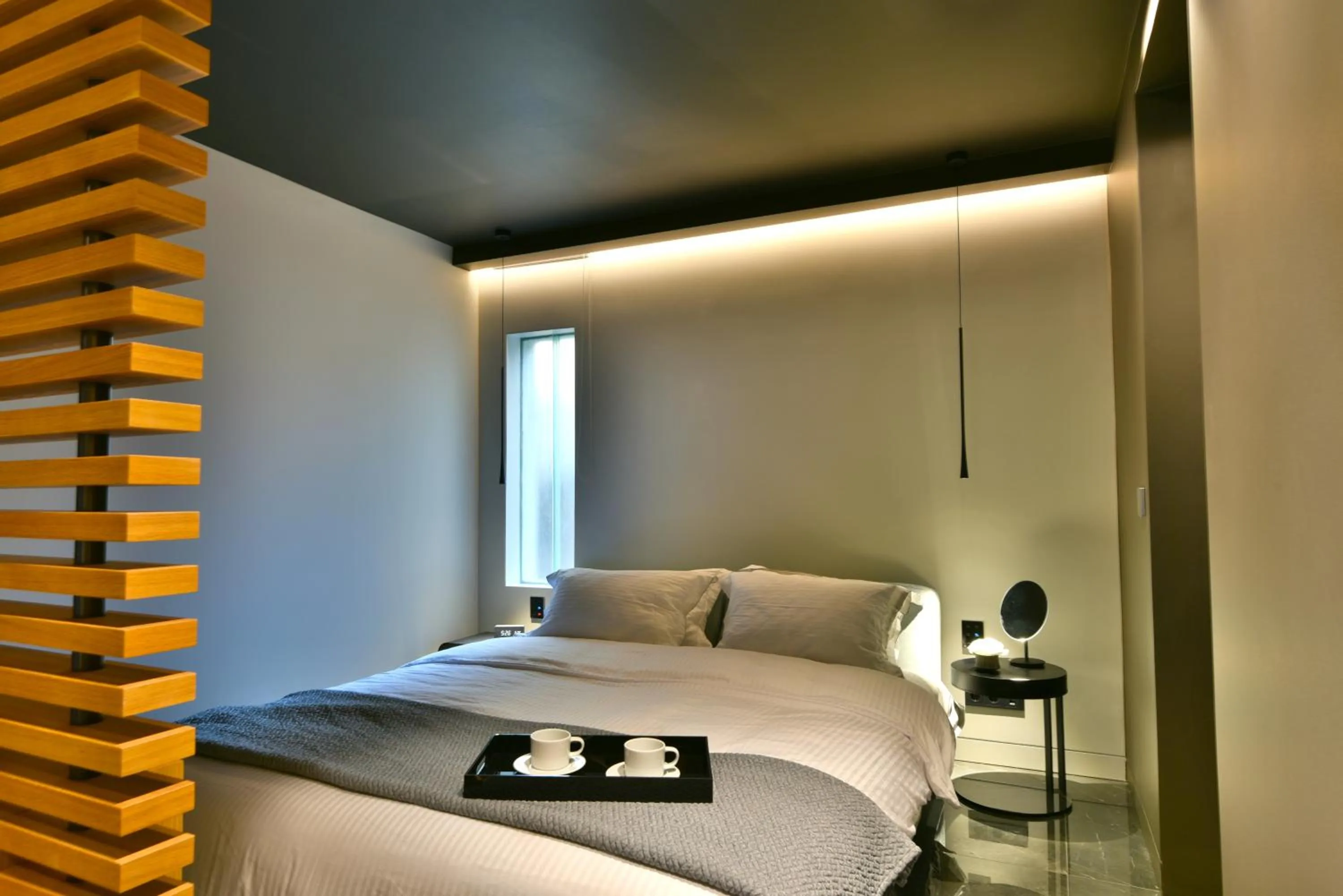 Bed in Nikiou Suites Luxury Residence
