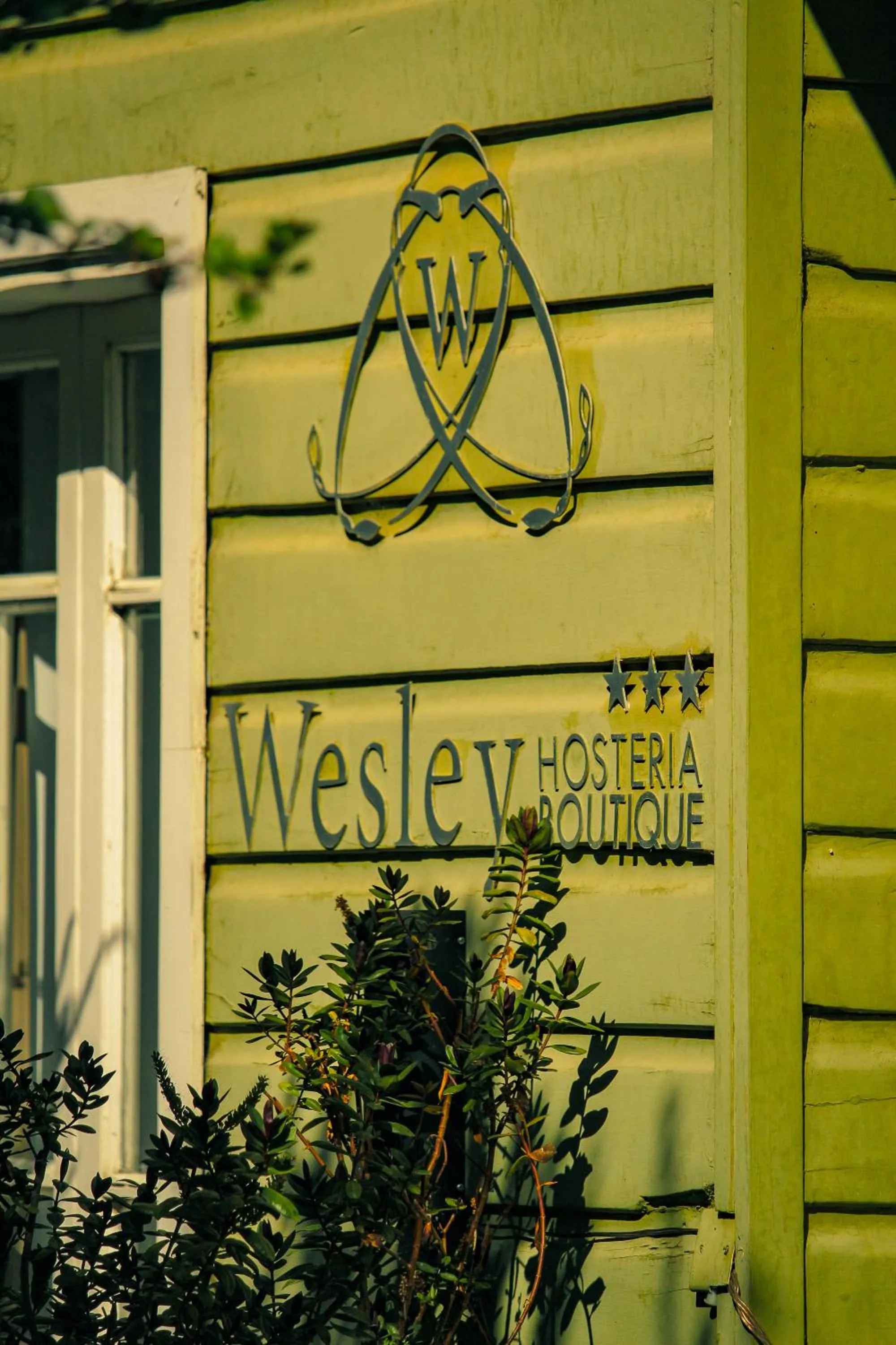 Property logo or sign in Wesley House Hosteria Boutique