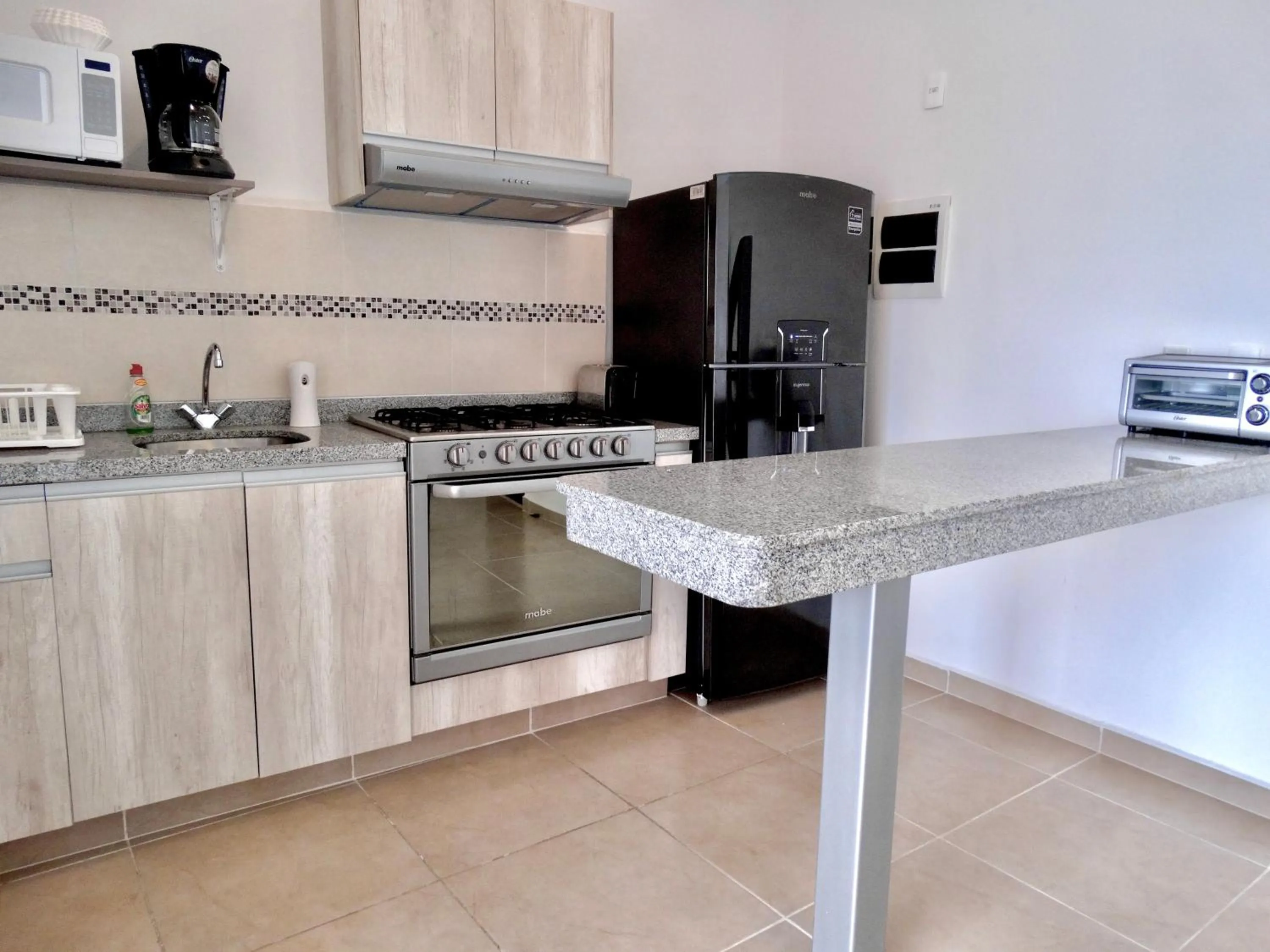 Kitchen or kitchenette in Dreams Lagoon by Andiani Travel