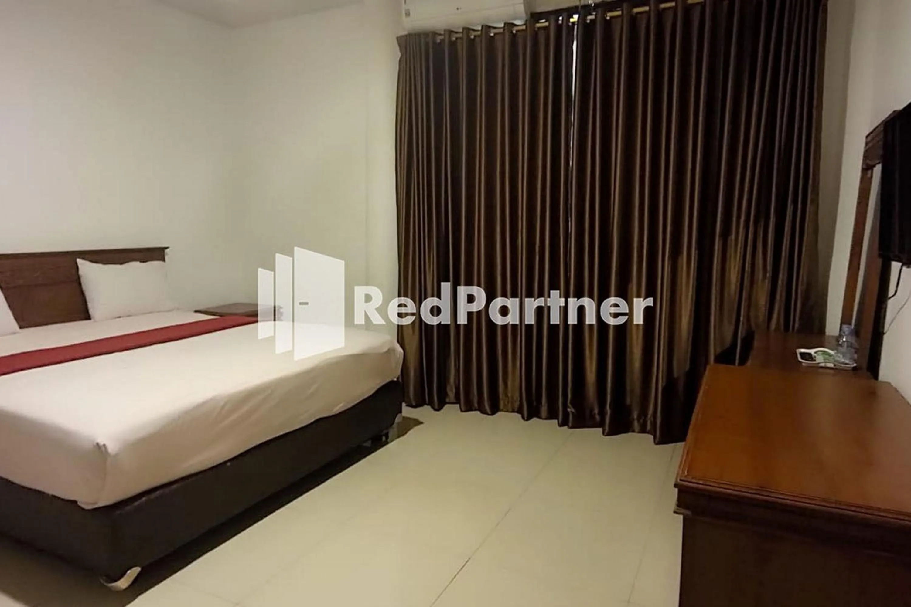 Bed in Hotel Abna Sangatta Mitra RedDoorz