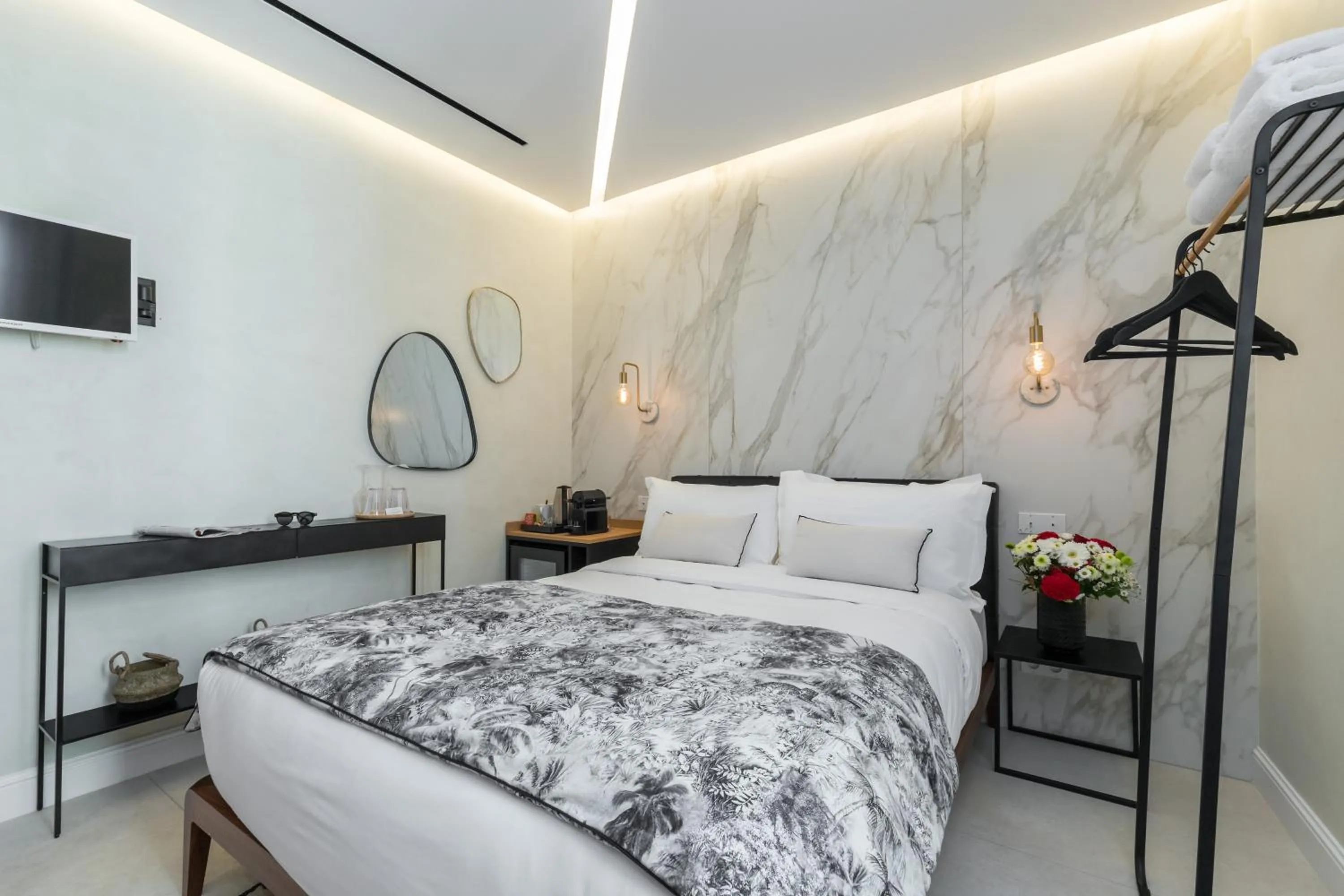 Bed in Le Dortoir Boutique Suites