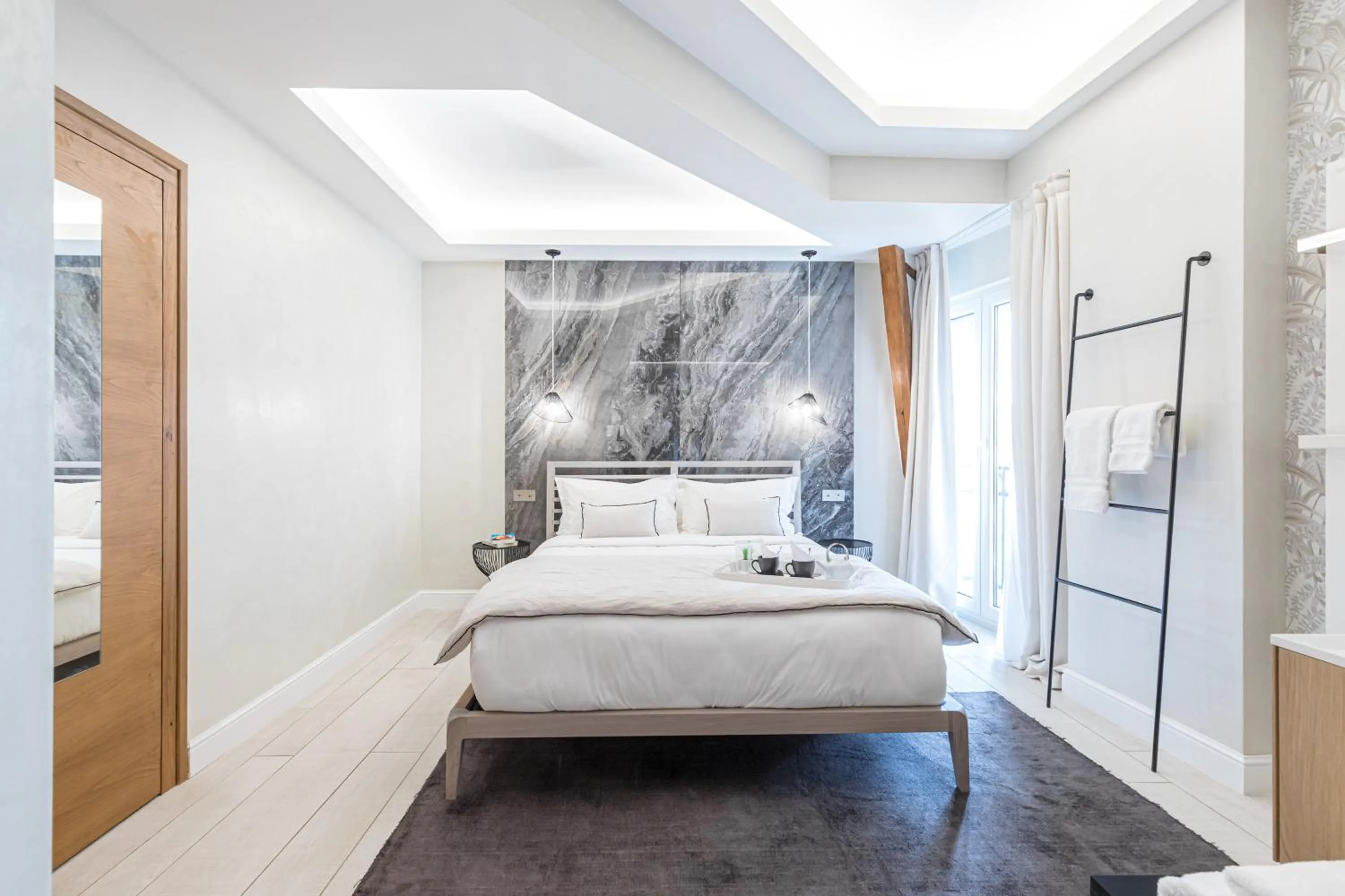 Bed in Le Dortoir Boutique Suites