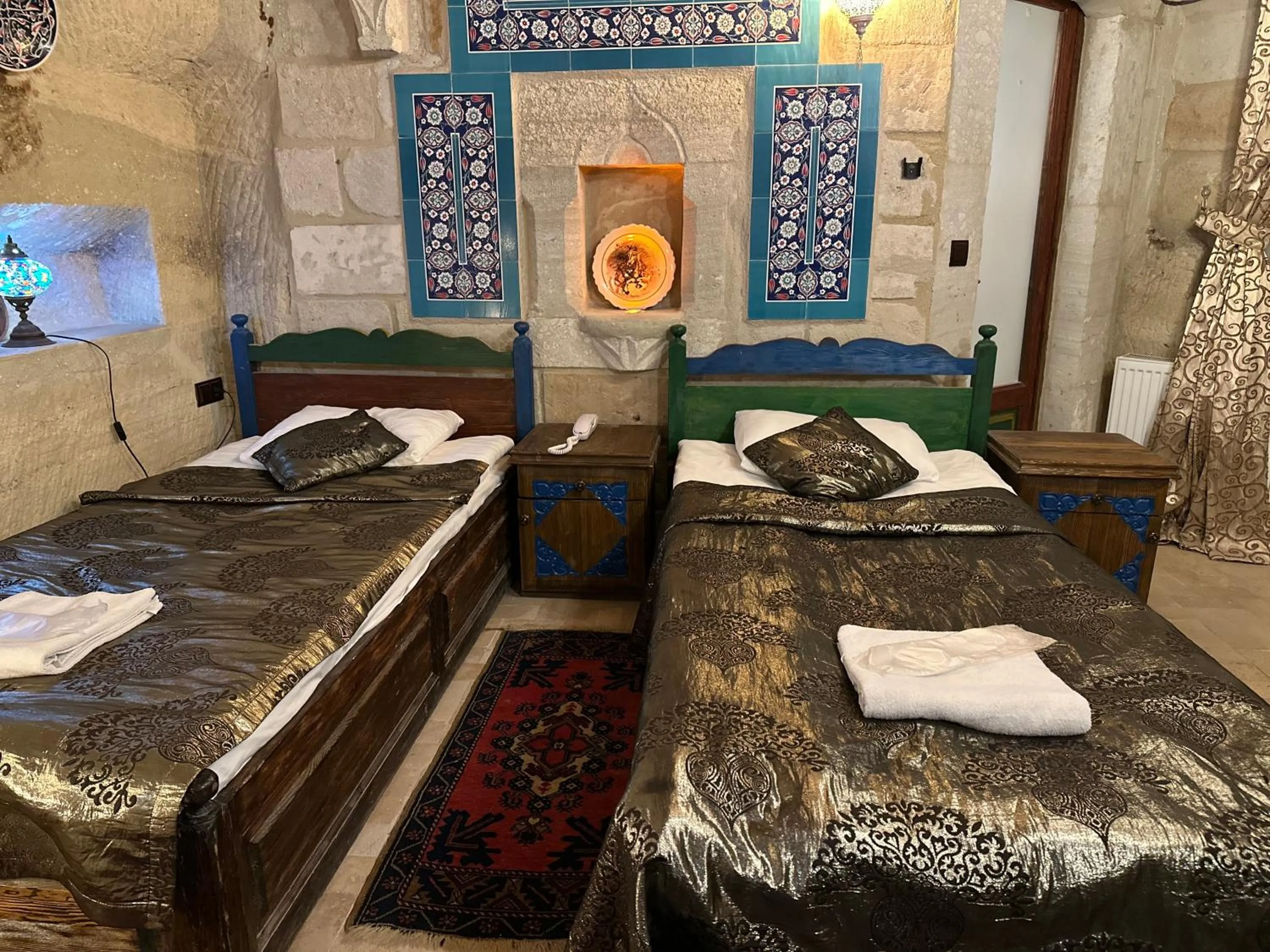 Bed in Goreme Palace Cave Suites