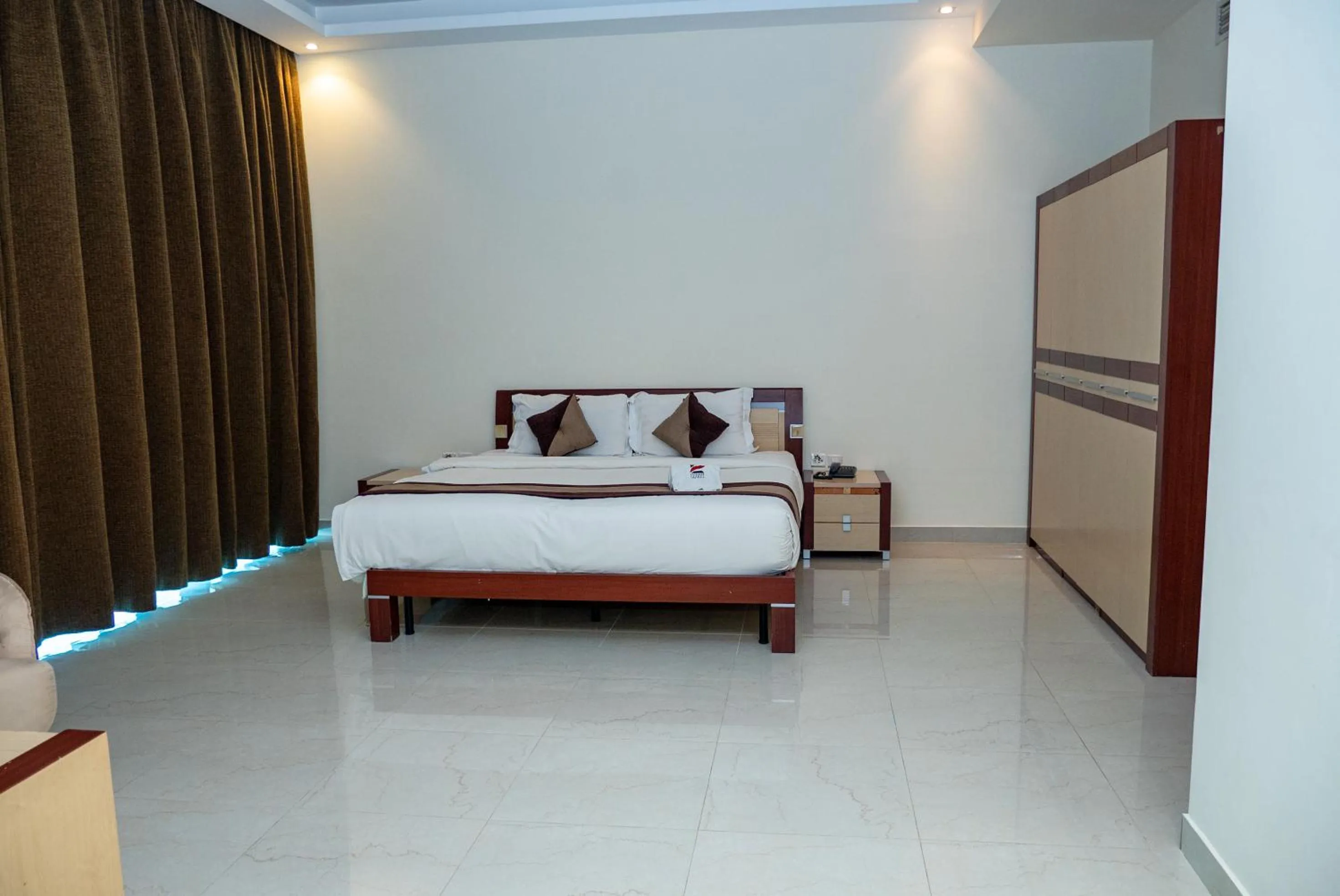 Bed in Excelsior Luxury Apartments