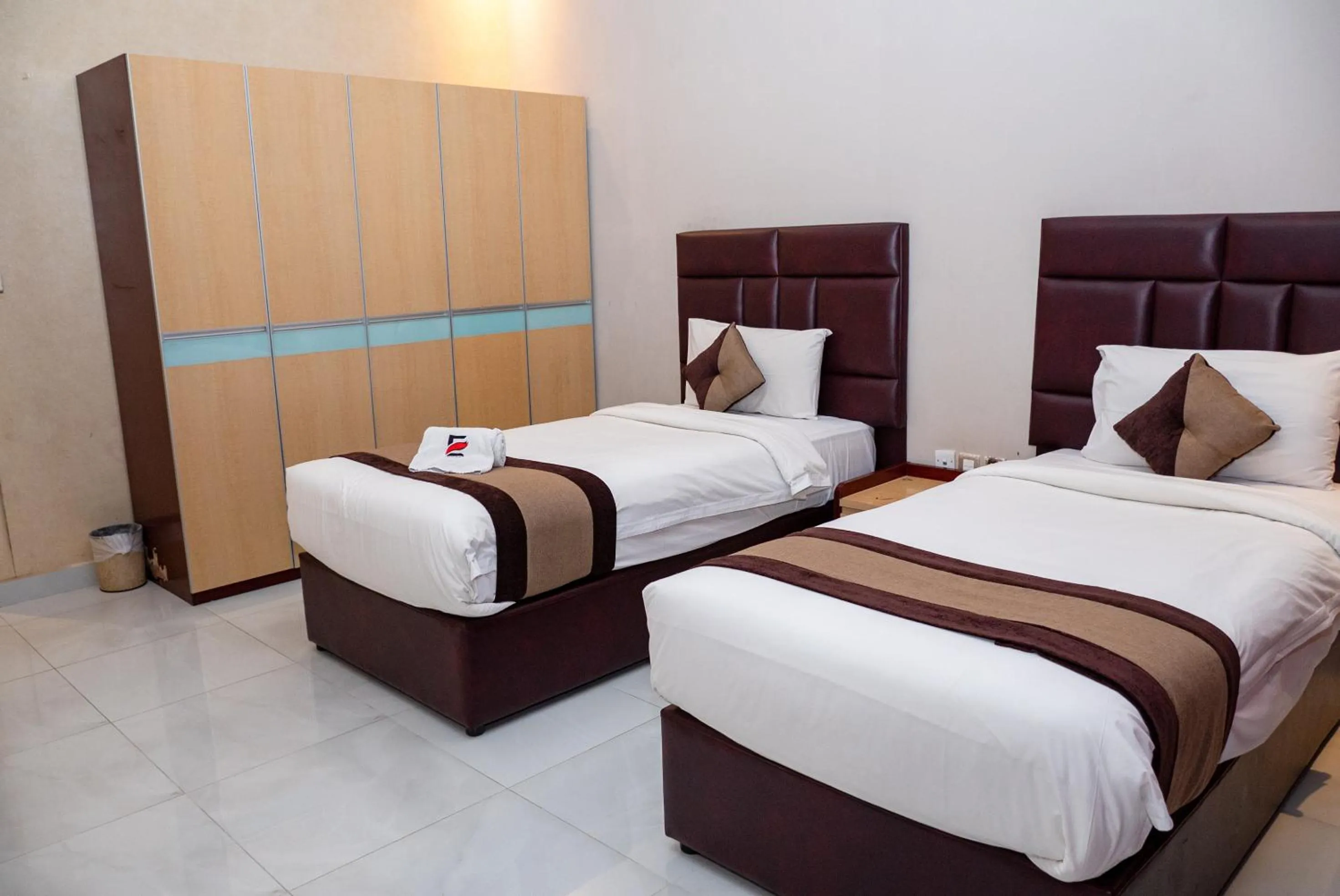 Bed in Excelsior Luxury Apartments