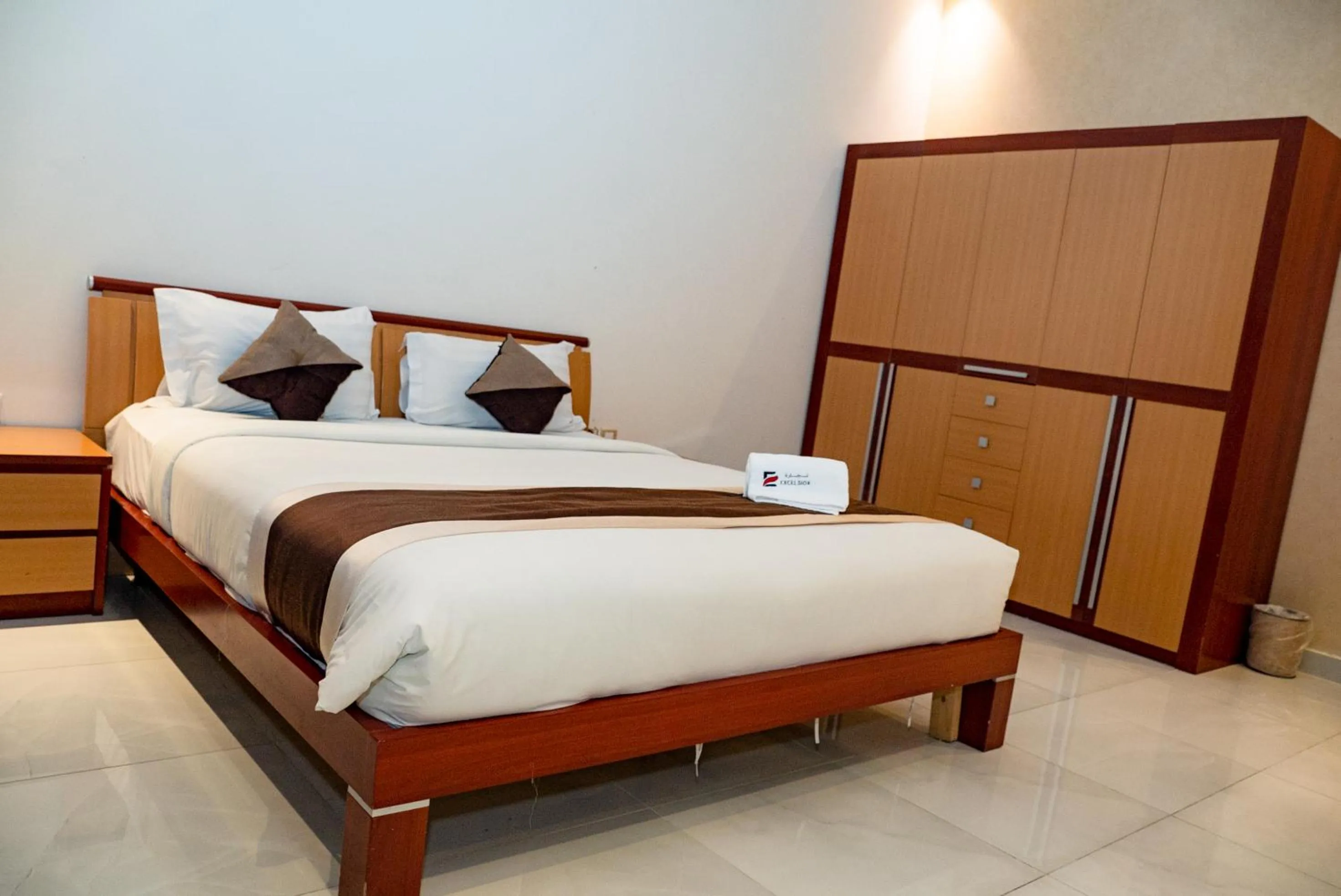 Bed in Excelsior Luxury Apartments