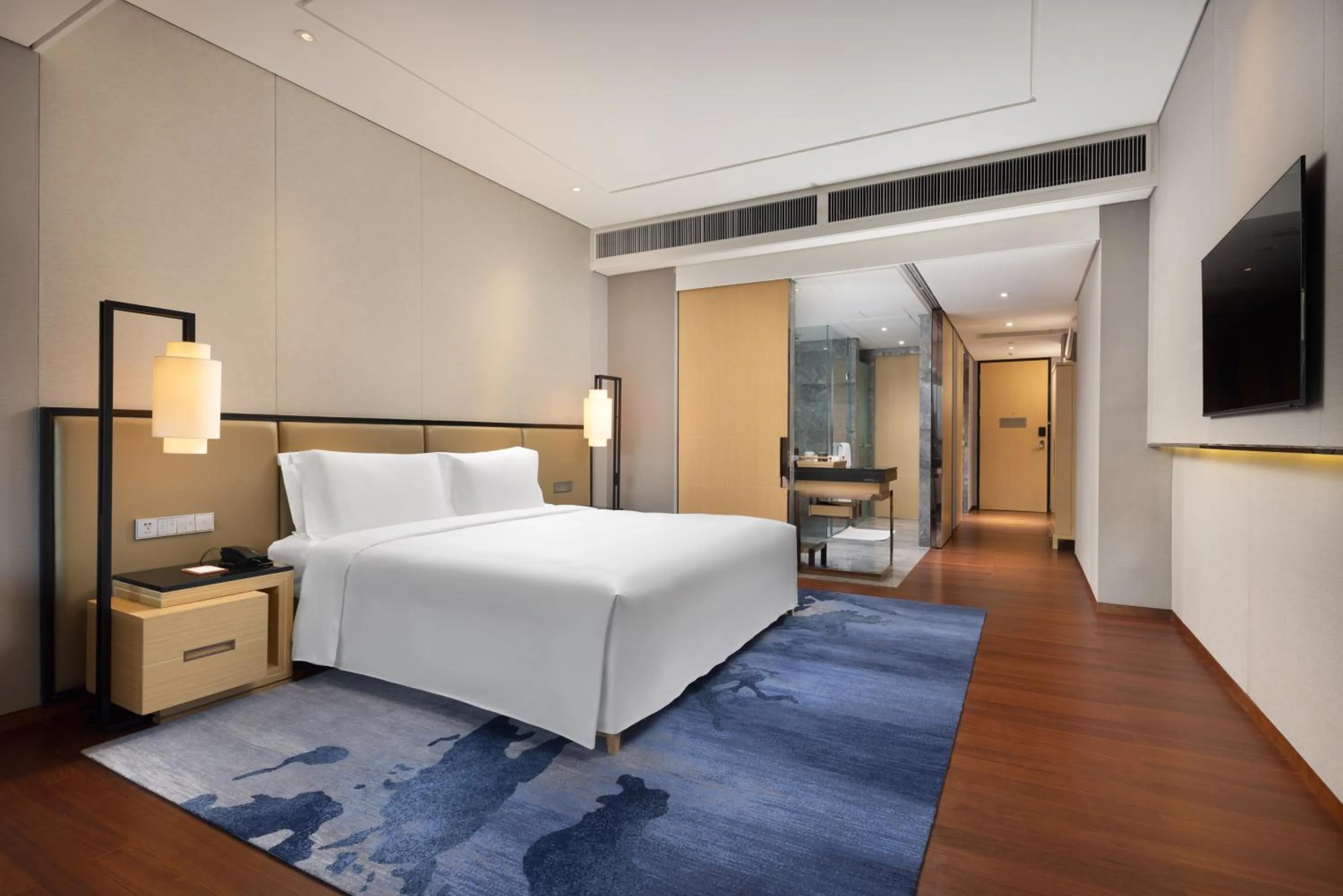 Bed in New World Beijing Hotel