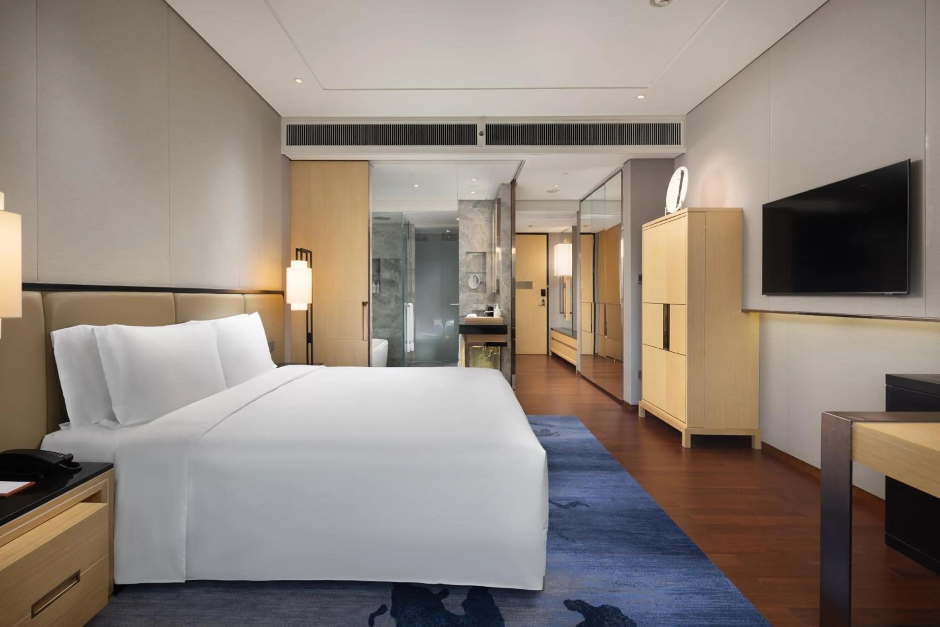 Bed in New World Beijing Hotel