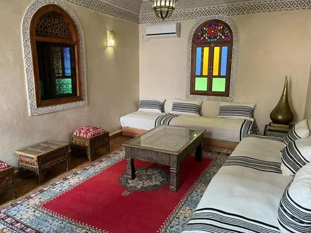 Living room, Bed in Riad le petit ksar