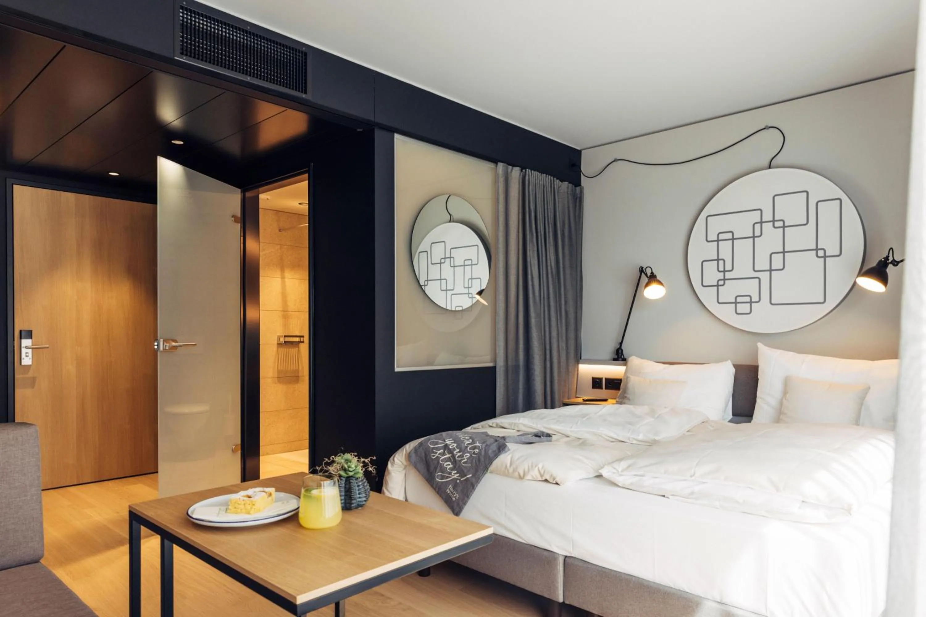 Photo of the whole room, Bed in harry's home Bern-Expo