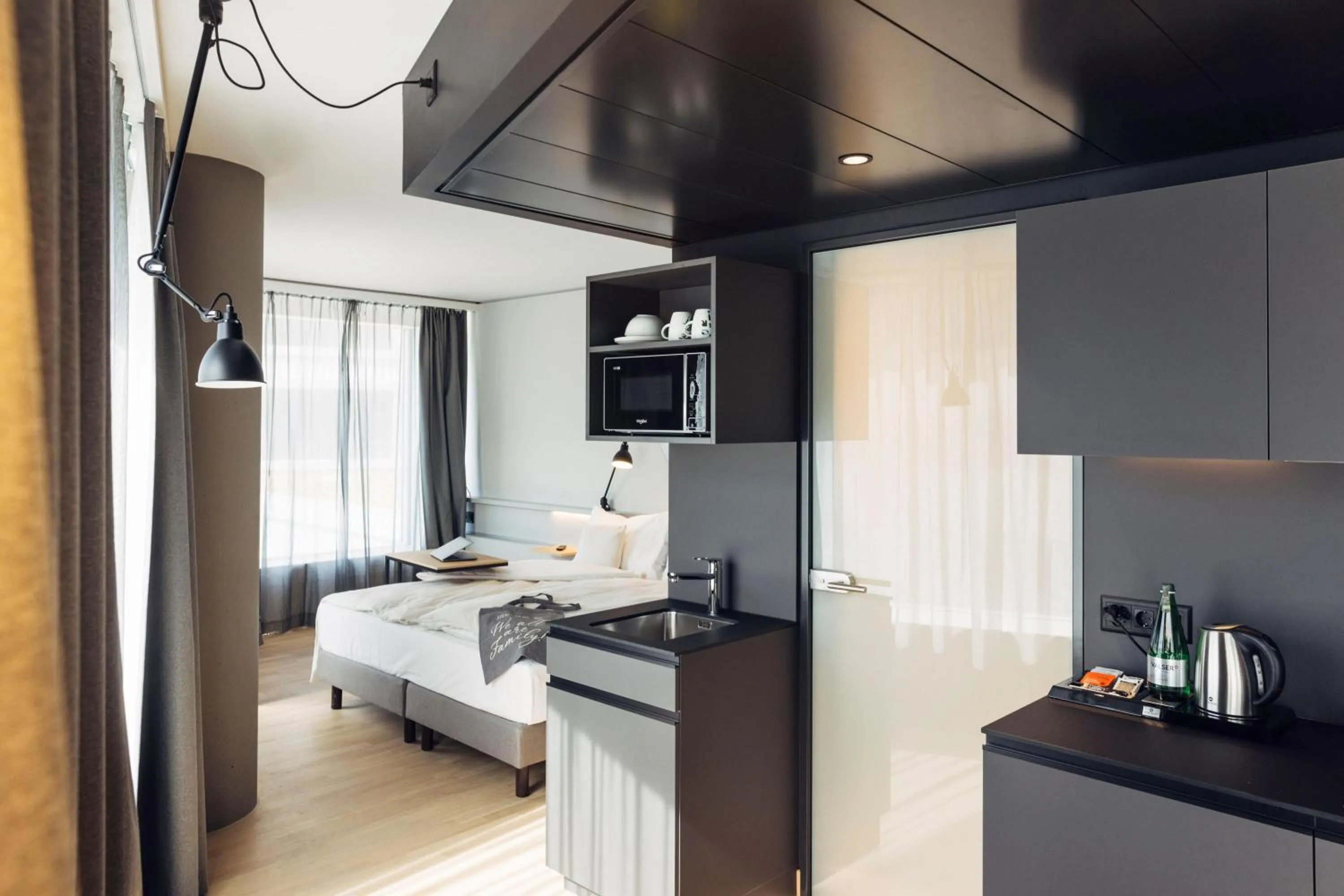 Photo of the whole room, Bed in harry's home Bern-Expo