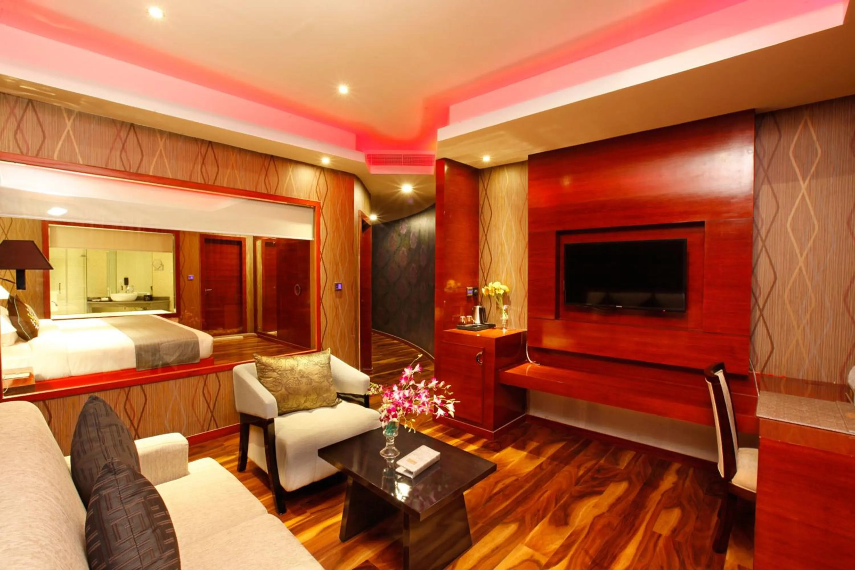 Seating area, Bed in Ramada by Wyndham Alleppey