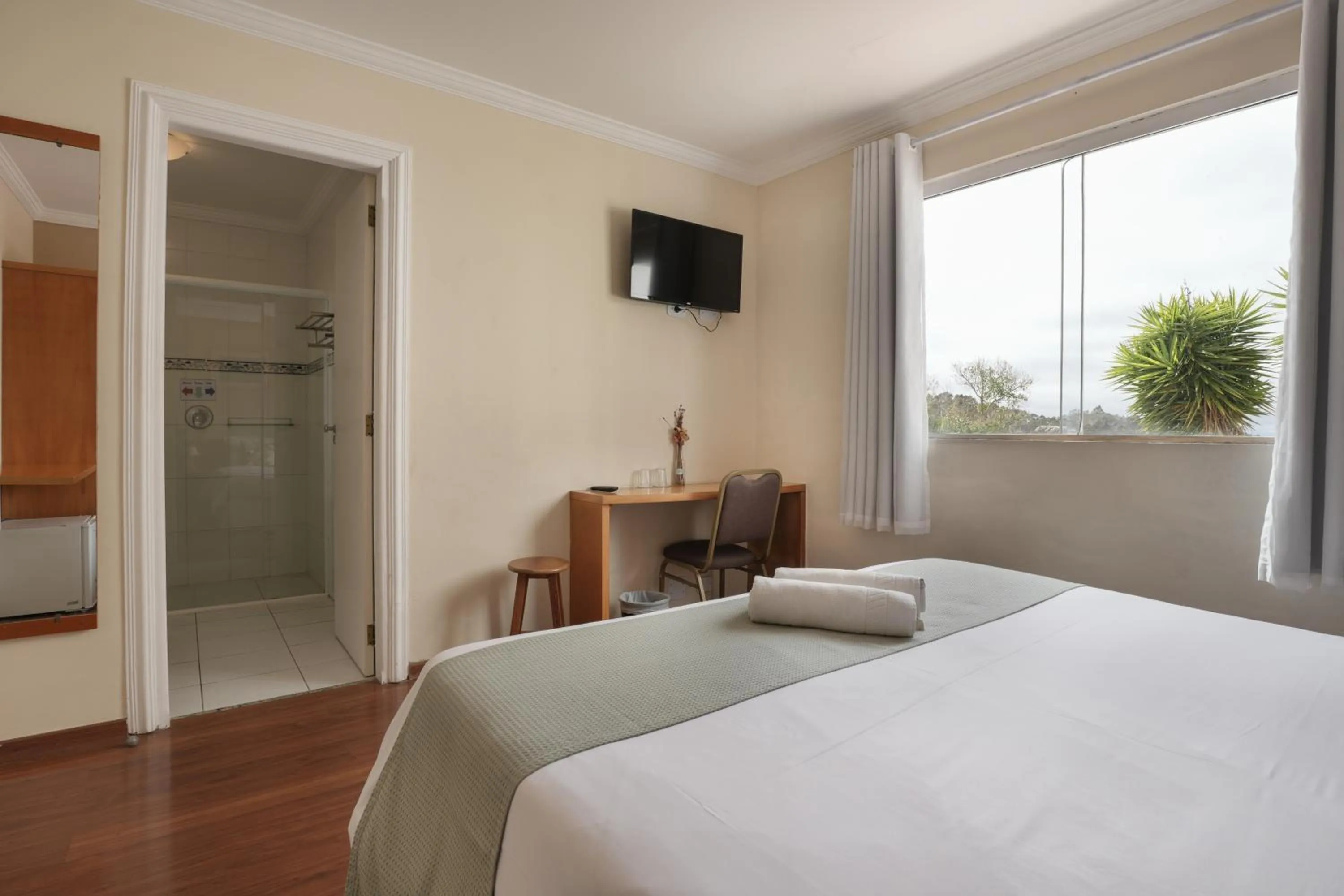 Bed in Pousada Parque das Flores