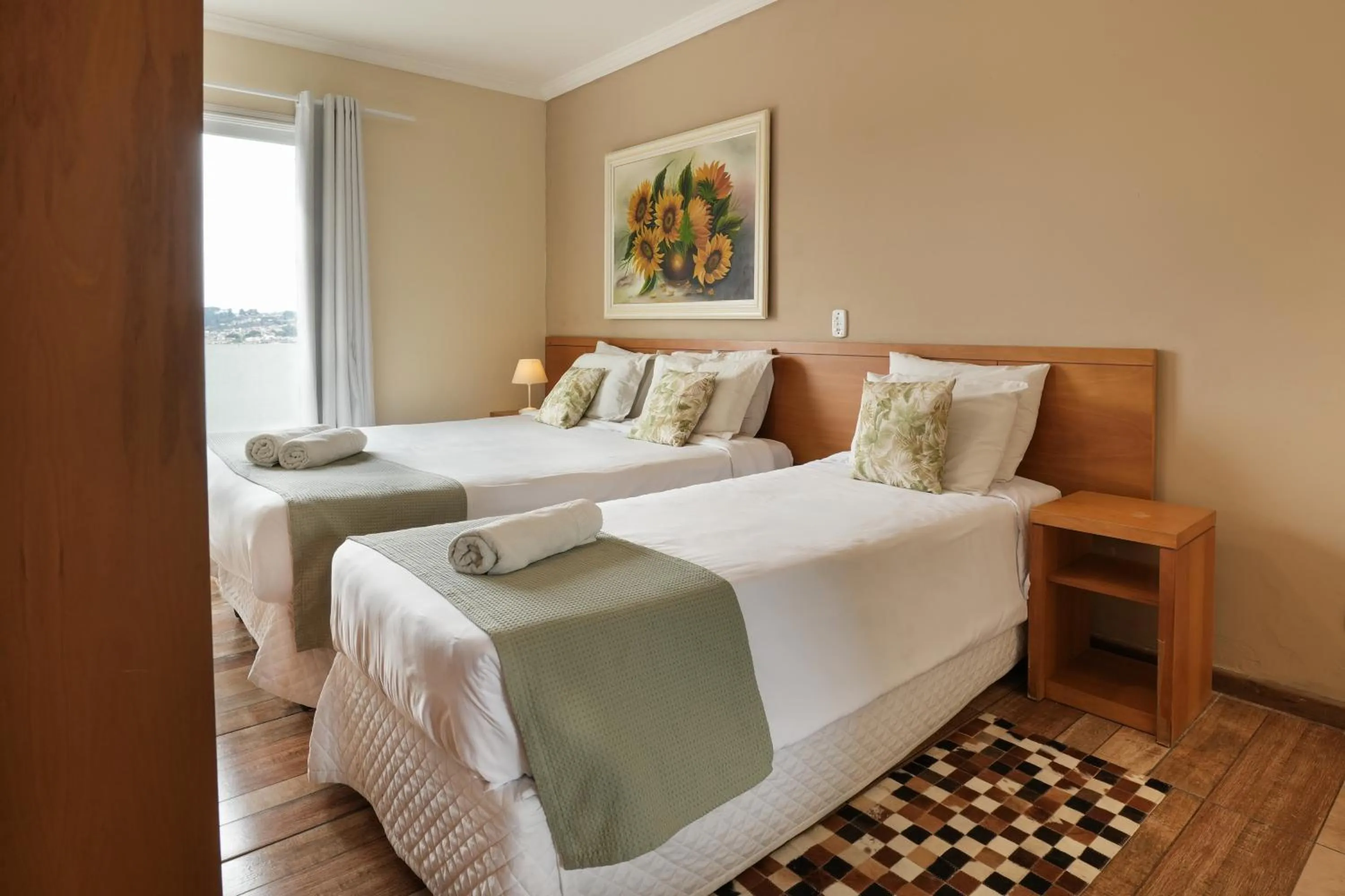 Bed in Pousada Parque das Flores