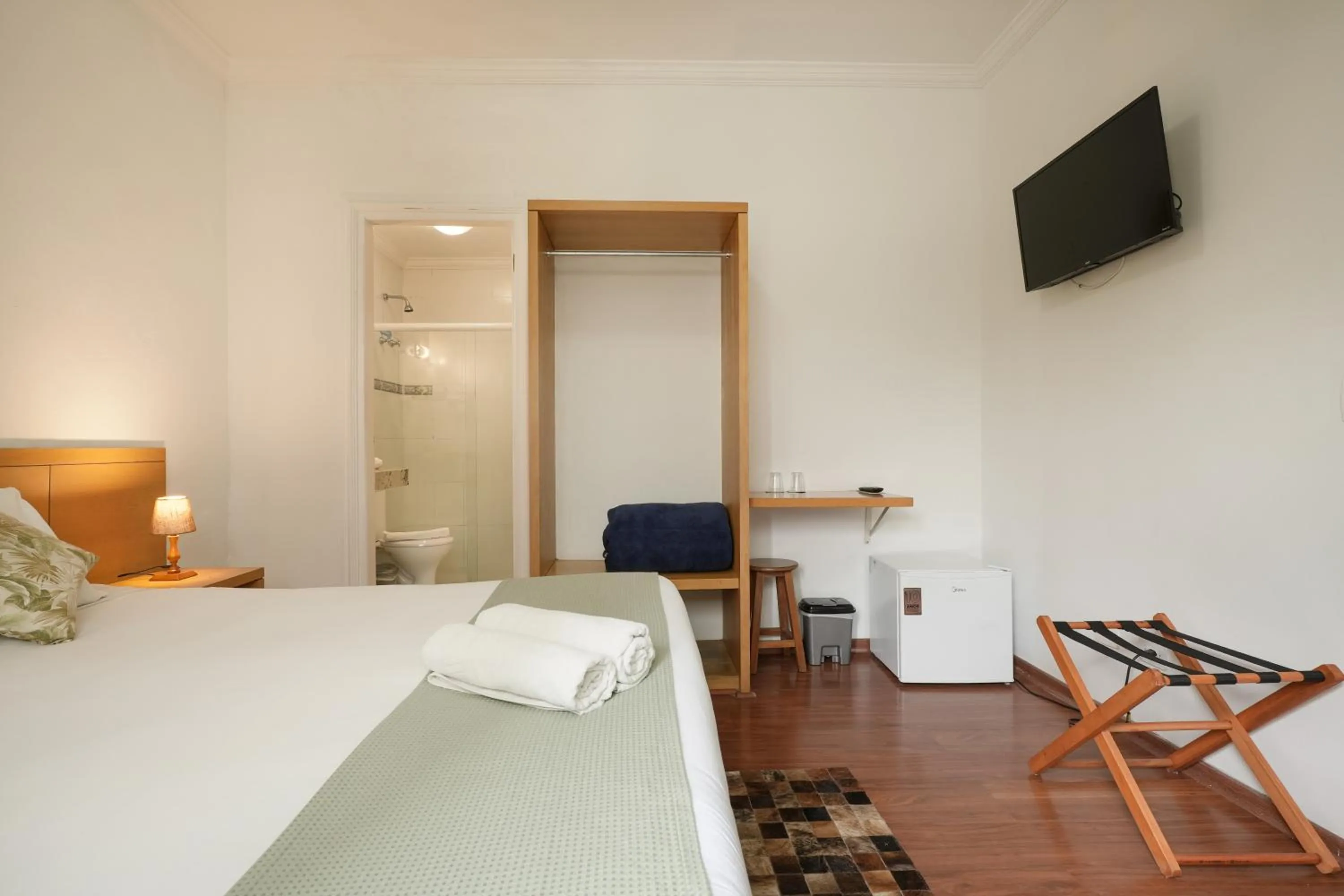 Bed in Pousada Parque das Flores