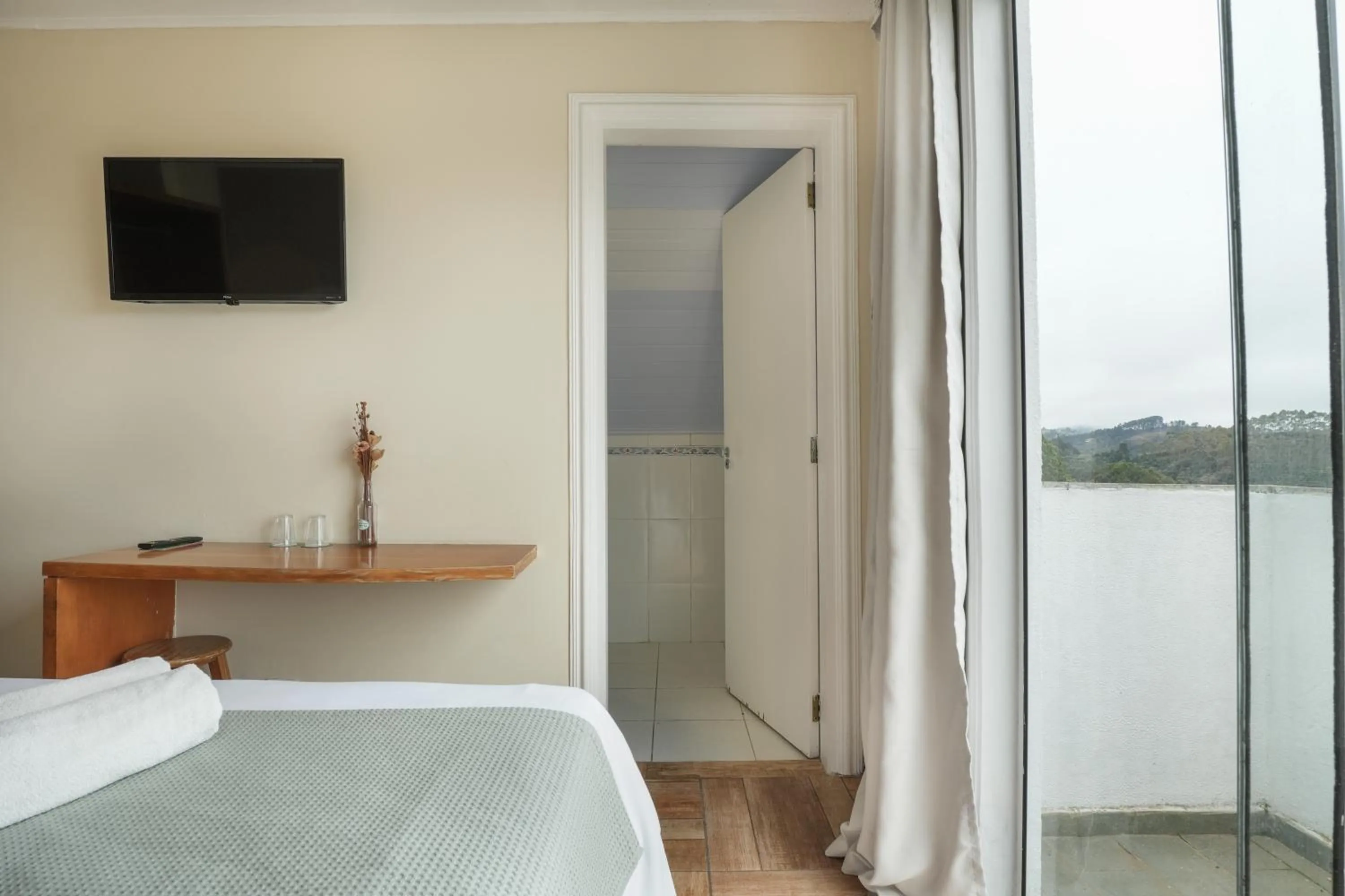 Bed in Pousada Parque das Flores