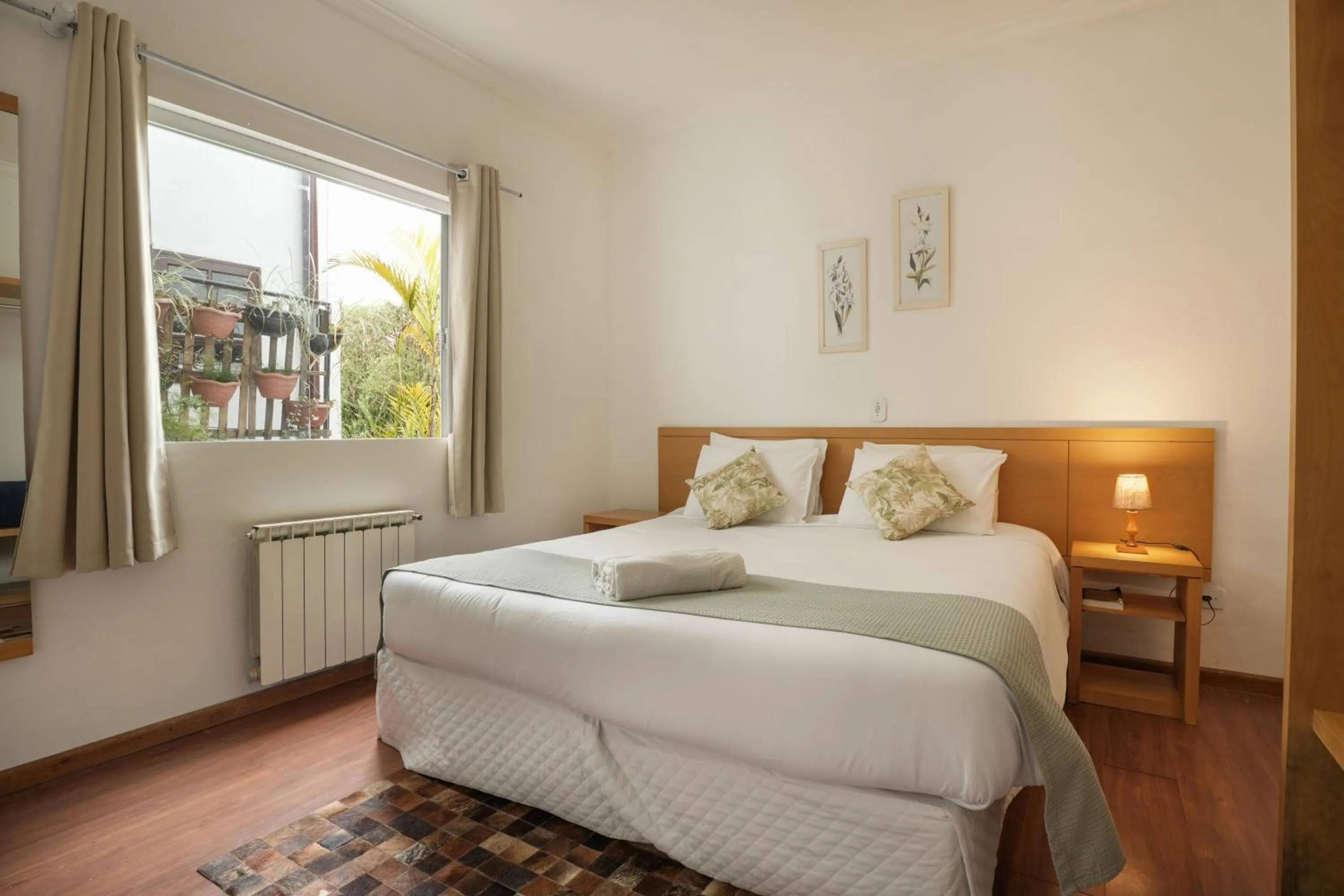 Bed in Pousada Parque das Flores