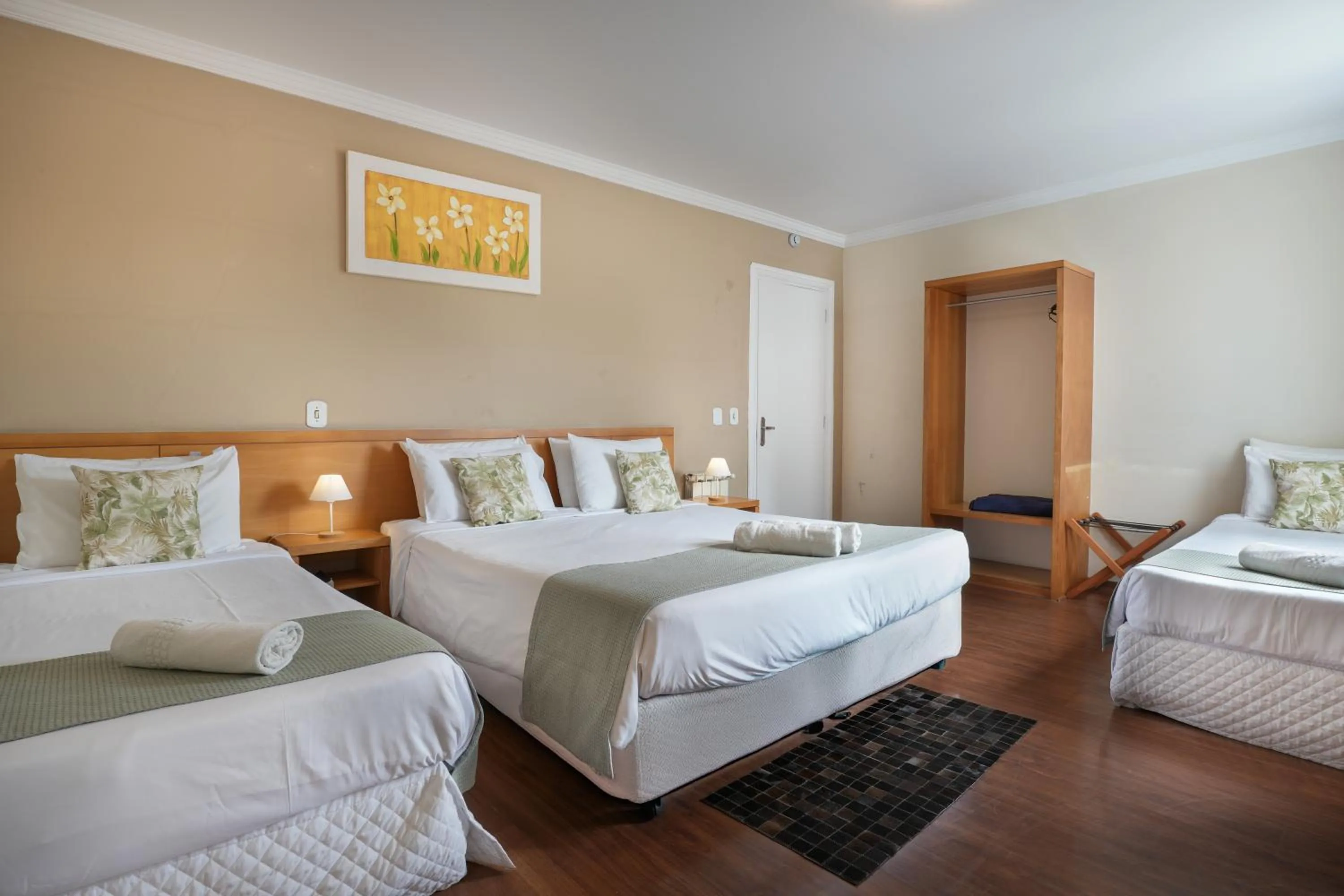 Bed in Pousada Parque das Flores