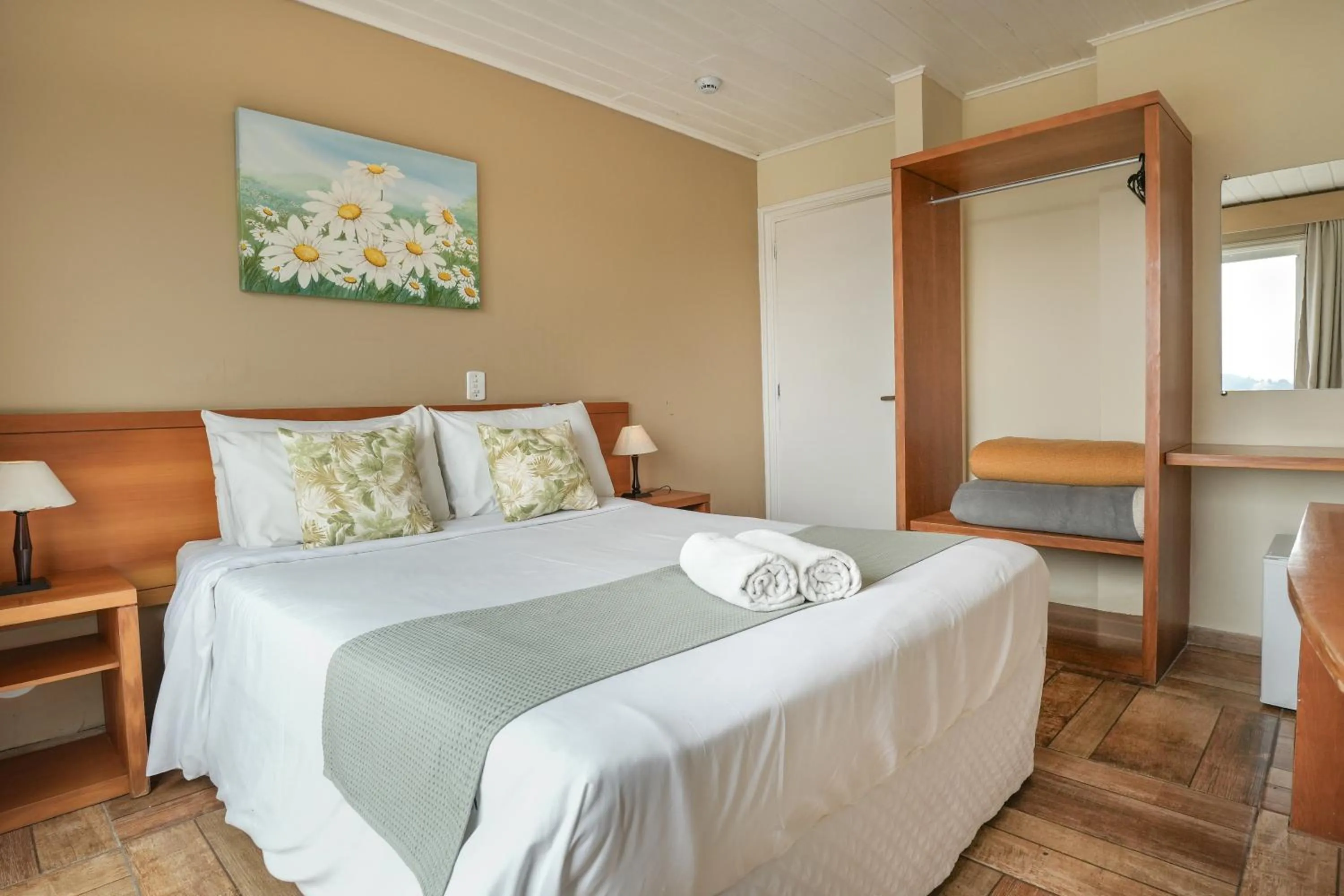 Bed in Pousada Parque das Flores