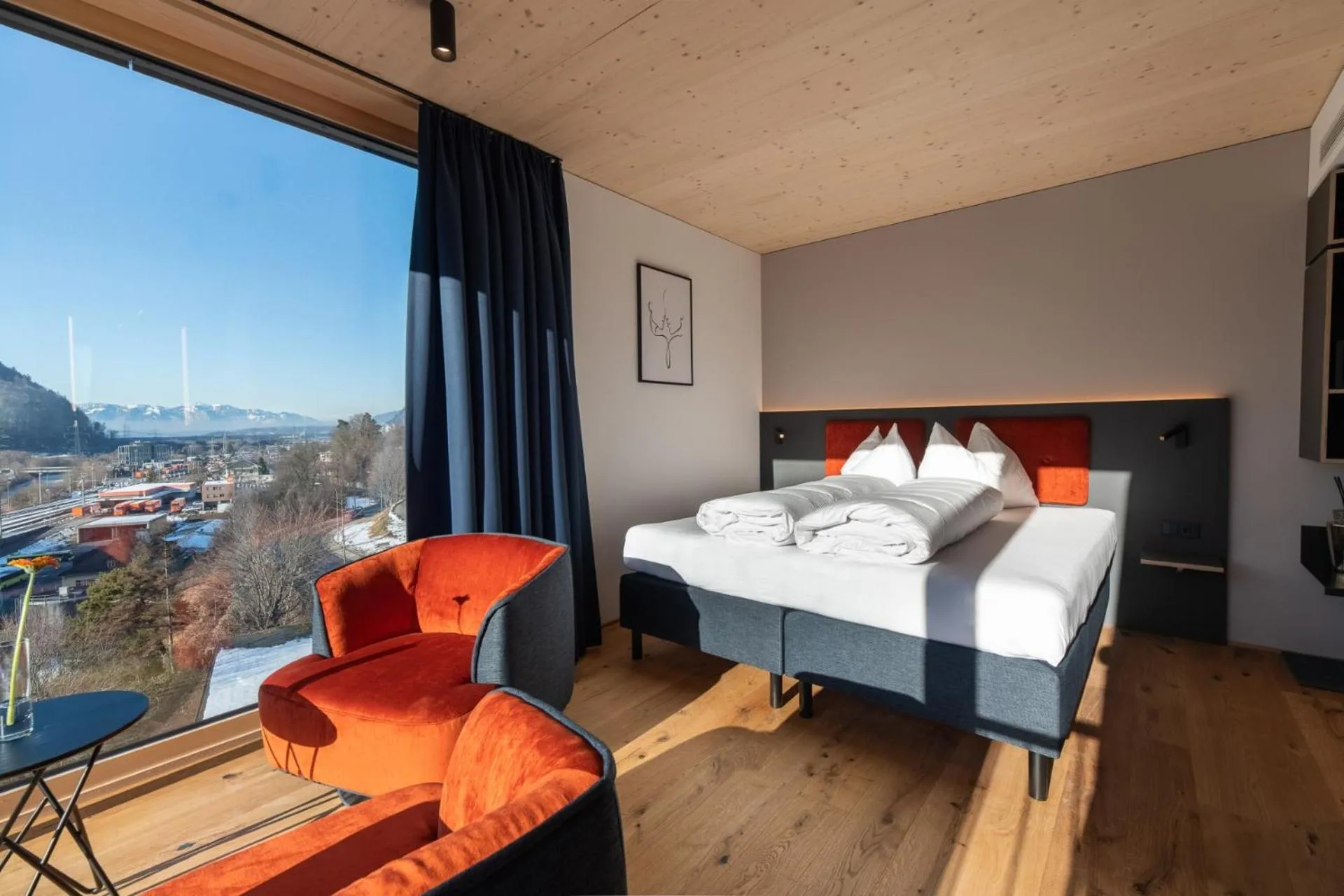 Bed in ALPSTADT LIFESTYLE Hotel
