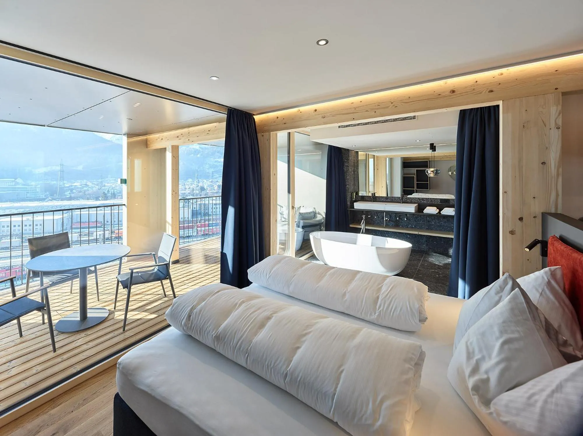 Bed in ALPSTADT LIFESTYLE Hotel