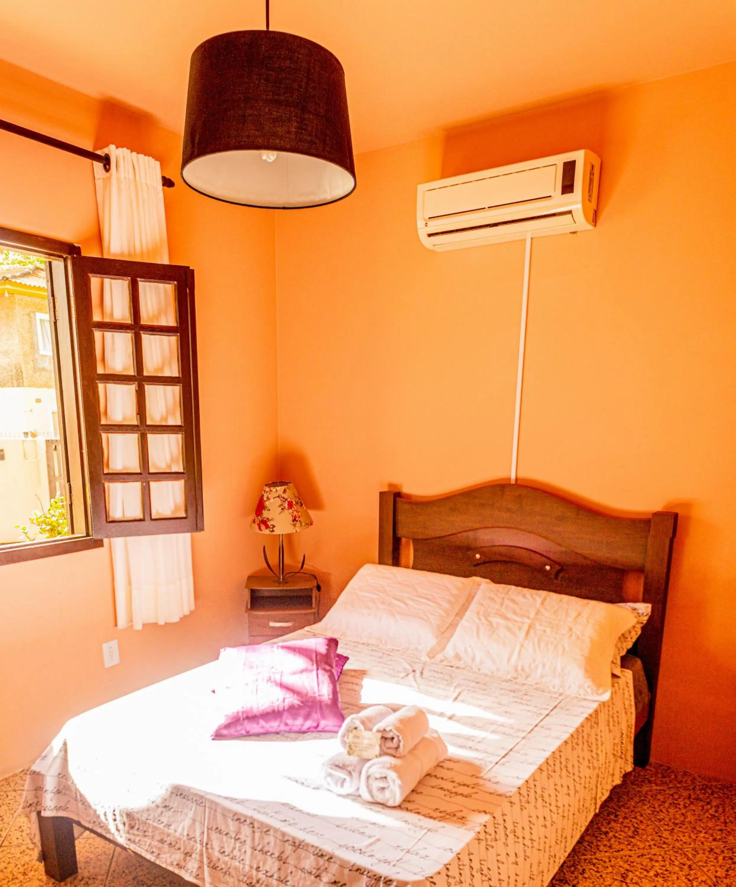 Bed in Pousada Casa do Oscar